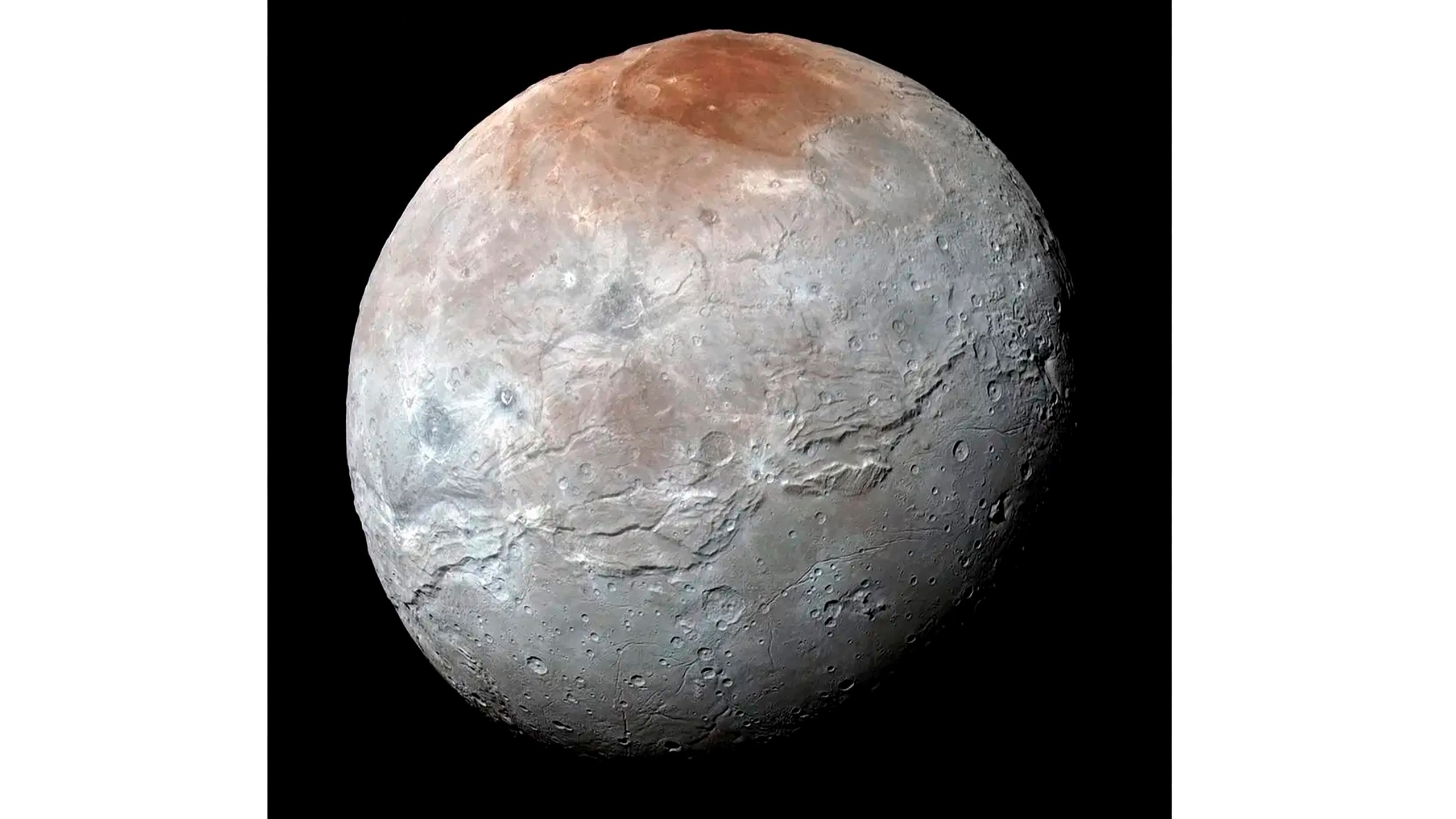 This image provided by NASA shows an enhanced color view of Pluto’s big moon Charon captured by the New Horizons spacecraft, July 14, 2015. (NASA via AP)