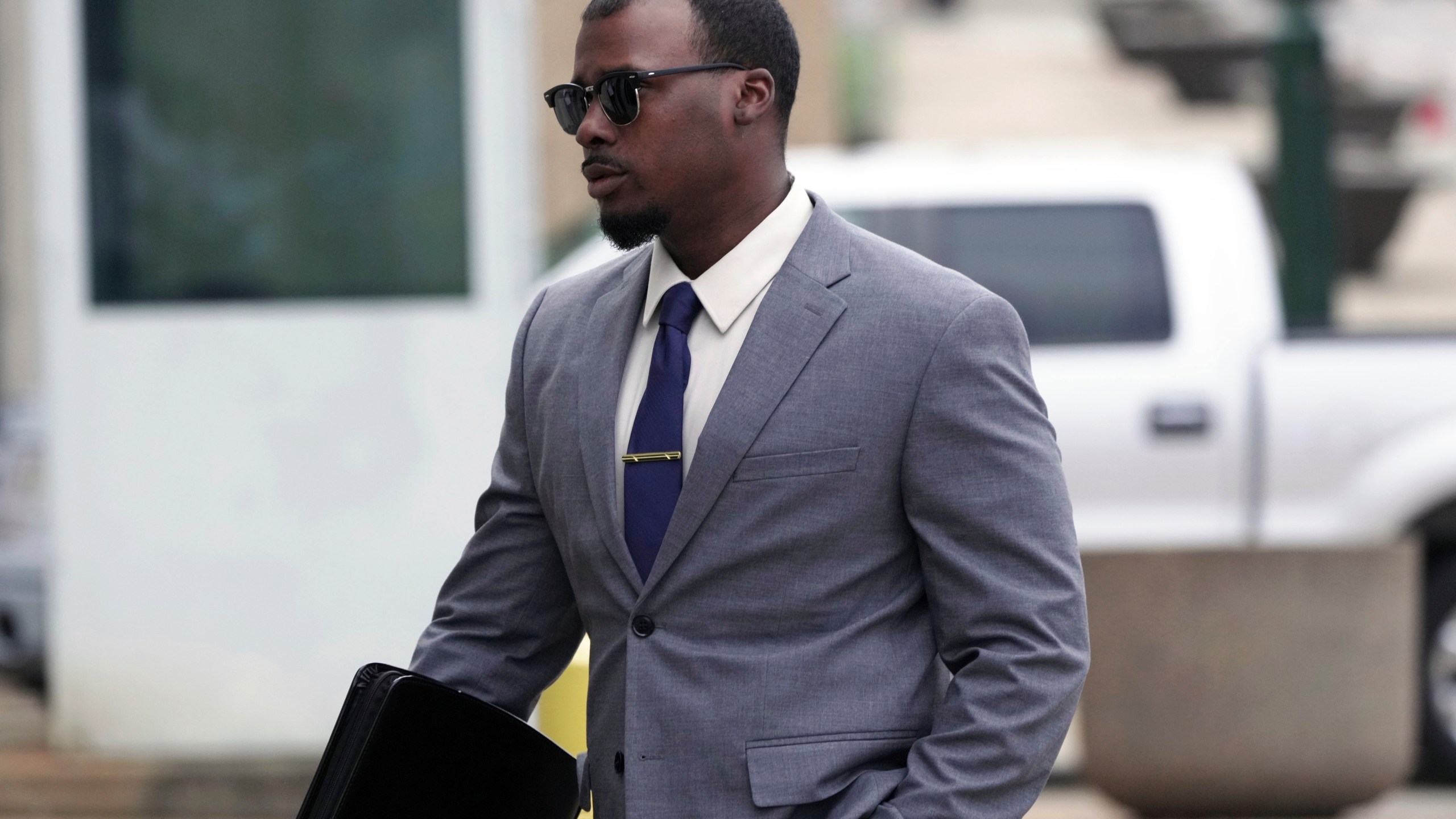 Justin Smith, one of three former Memphis police officers charged in the 2023 fatal beating of Tyre Nichol, arrives at the federal courthouse for the day's proceedings on Tuesday, Oct. 1, 2024, in Memphis, Tenn. (AP Photo/Karen Pulfer Focht)