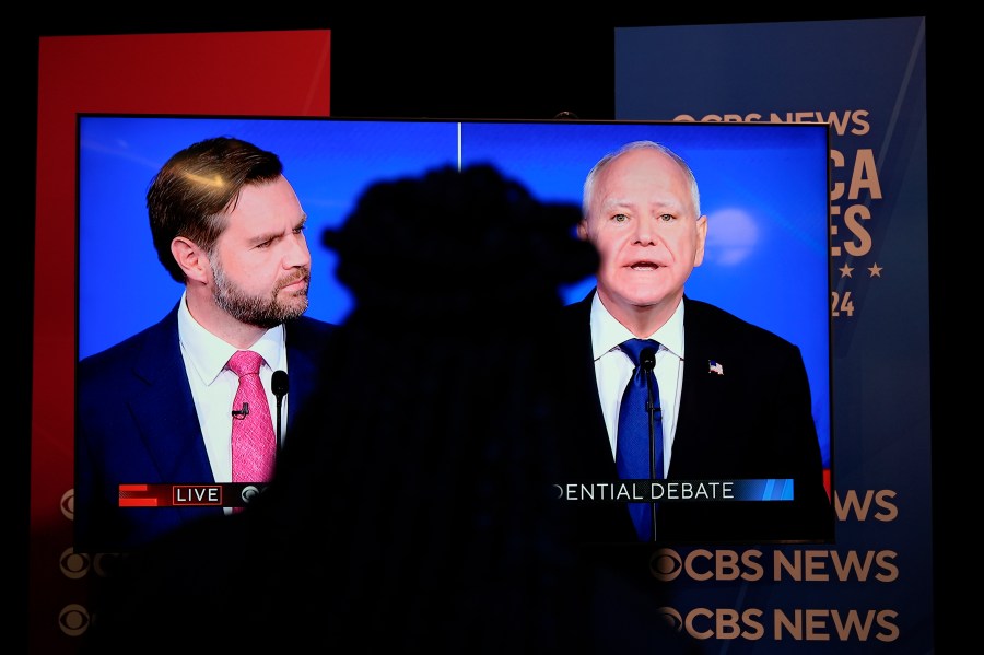 Viewers in the spin room watch the CBS News vice presidential debate, Tuesday, Oct. 1, 2024, in New York. (AP Photo/Julia Demaree Nikhinson)