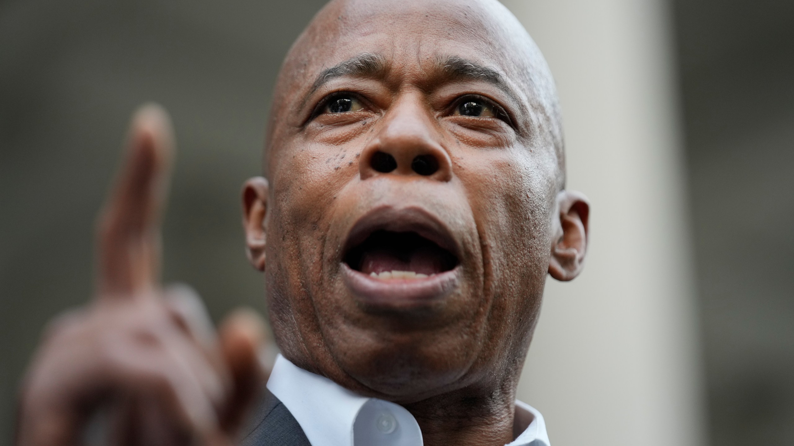 New York City Mayor Eric Adams speaks while surrounded by faith leaders and other supporters during a rally and prayer vigil on the steps of City Hall in New York, Tuesday, Oct. 1, 2024. (AP Photo/Seth Wenig)