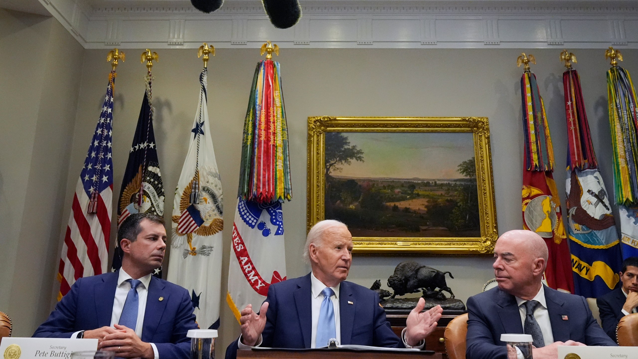 President Joe Biden speaks during a briefing on the government's response to Hurricane Helene in the Roosevelt Room of the White House in Washington, Tuesday, Oct. 1, 2024, as Secretary of Transportation Pete Buttigieg, left, and Secretary of Homeland Security Alejandro Mayorkas, right, look on. (AP Photo/Mark Schiefelbein)