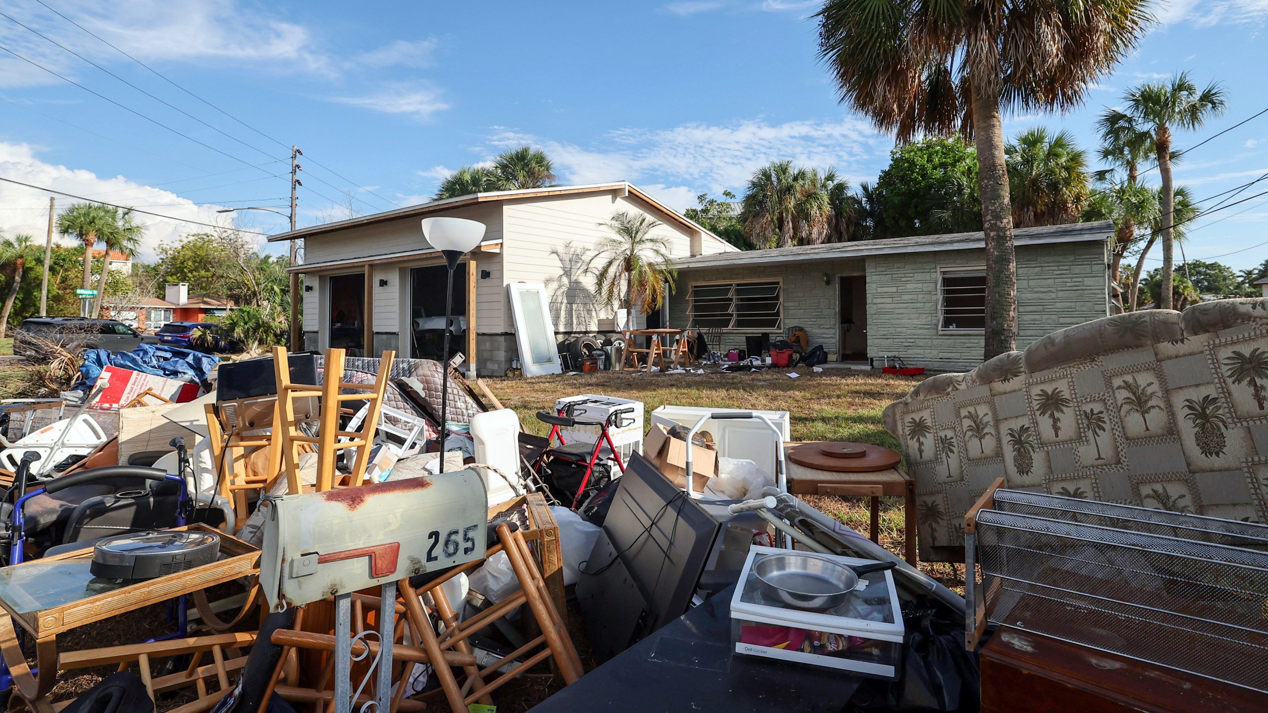 The contents of the house of Marjorie Havard, who was found deceased in the home, rests in a pile, Wednesday, Oct. 2, 2024, in Indian Rocks Beach, Fla. (AP Photo/Mike Carlson)