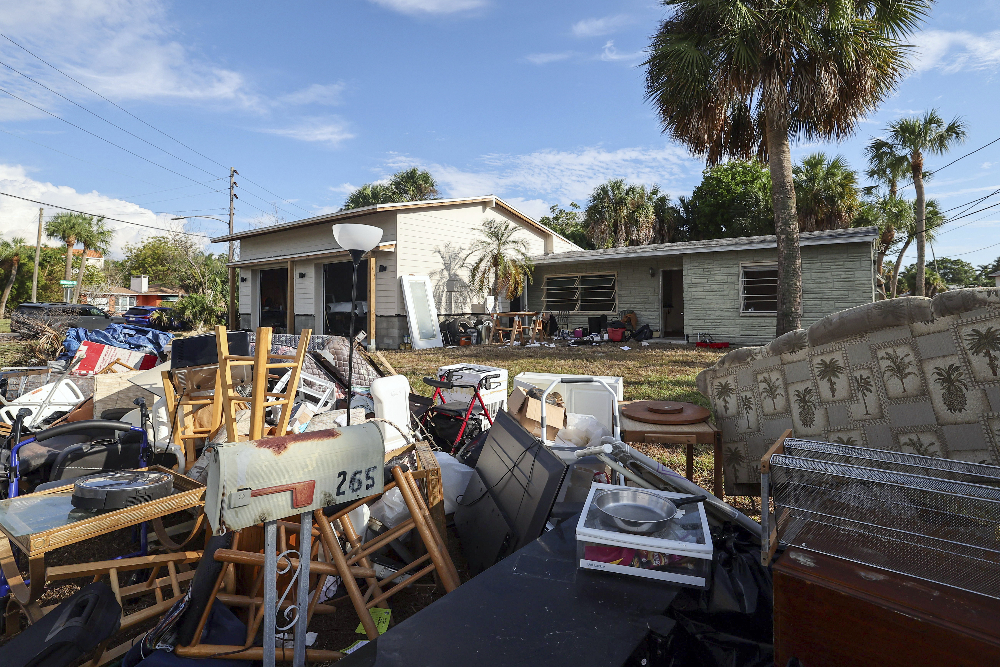 The contents of the house of Marjorie Havard, who was found deceased in the home, rests in a pile, Wednesday, Oct. 2, 2024, in Indian Rocks Beach, Fla. (AP Photo/Mike Carlson)