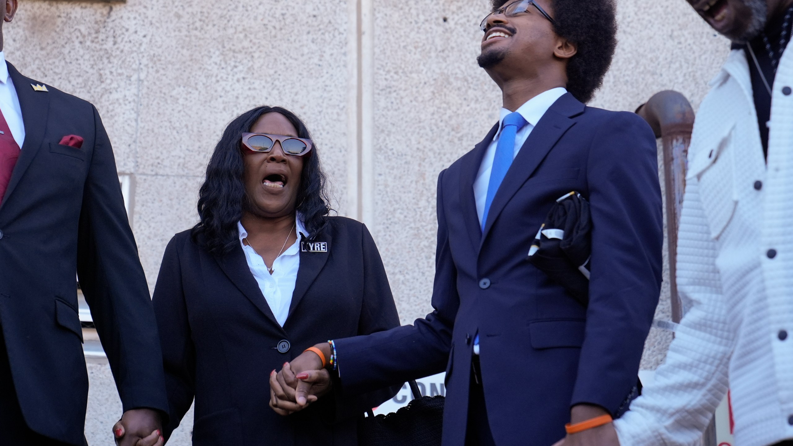 RowVaughn Wells, left, mother of Tyre Nichols, shouts her son's name with Rep. Justin J. Pearson, D-Memphis, second from right, before entering the federal courthouse for the trial of three former Memphis police officers charged in the 2023 fatal beating of her son Wednesday, Oct. 2, 2024, in Memphis, Tenn. (AP Photo/George Walker IV)