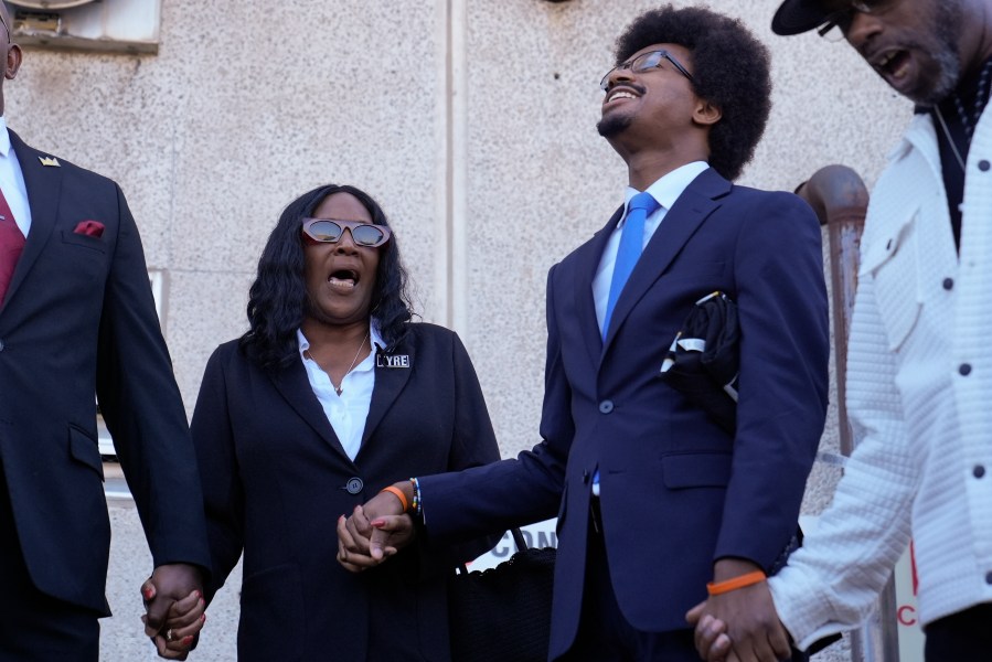 RowVaughn Wells, left, mother of Tyre Nichols, shouts her son's name with Rep. Justin J. Pearson, D-Memphis, second from right, before entering the federal courthouse for the trial of three former Memphis police officers charged in the 2023 fatal beating of her son Wednesday, Oct. 2, 2024, in Memphis, Tenn. (AP Photo/George Walker IV)