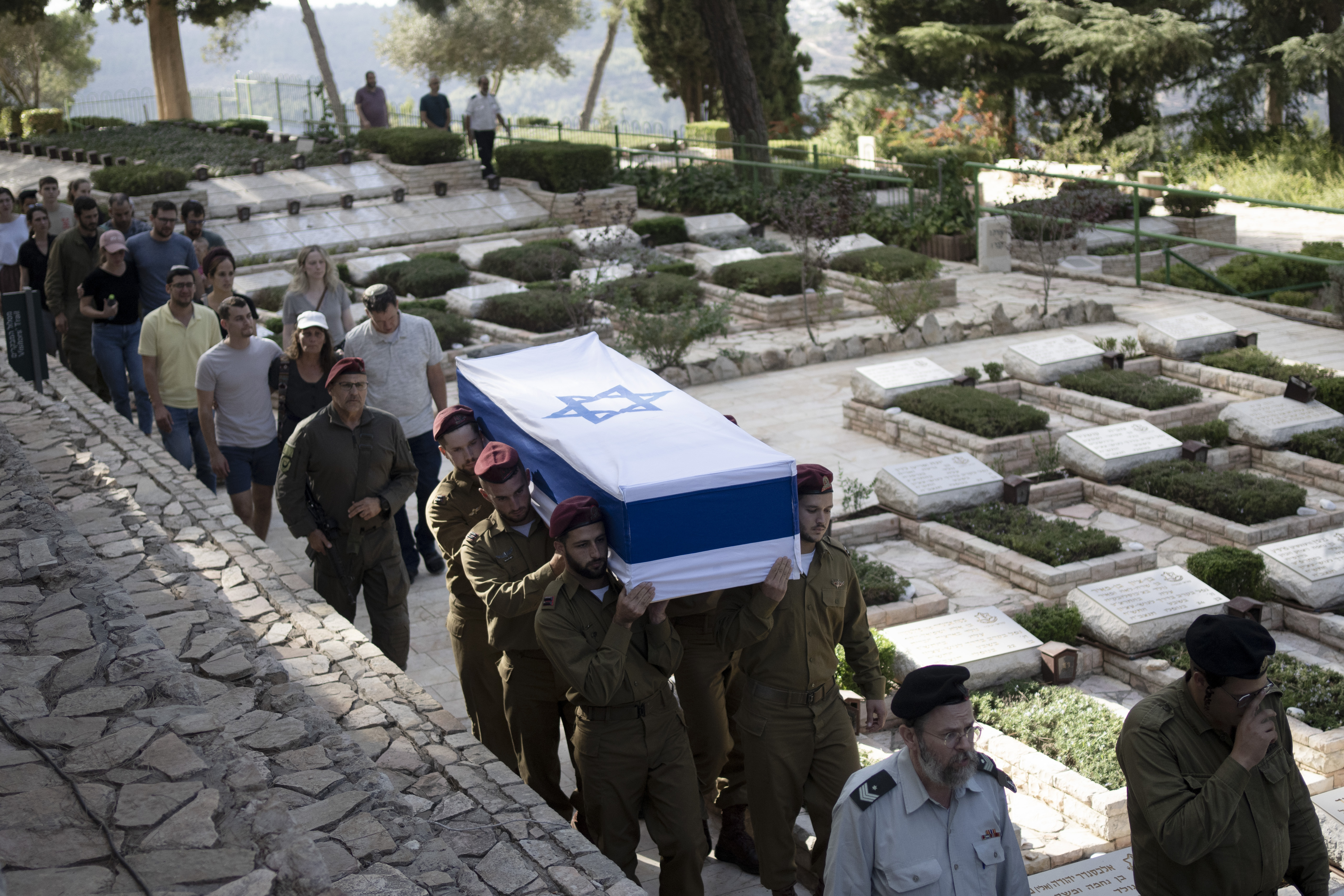 Soldiers carry the coffin of Israeli Army Capt. Eitan Yitzhak Oster, who was killed in action in Lebanon, during his funeral at Mt. Herzl military cemetery in Jerusalem, Wednesday, Oct. 2, 2024. (AP Photo/Maya Alleruzzo)