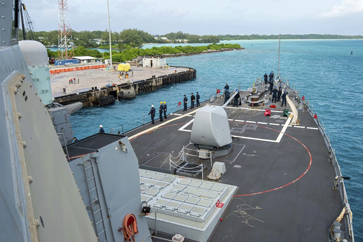 This photo provided by the U.S. Navy on Feb. 11, 2023 shows U.S. Navy Sailors aboard the USS Paul Hamilton (DDG 60) during a routine port visit at Diego Garcia. (U.S. Navy photo by Mass Communication Specialist 2nd Class Elliot Schaudt/U.S. Navy via AP)