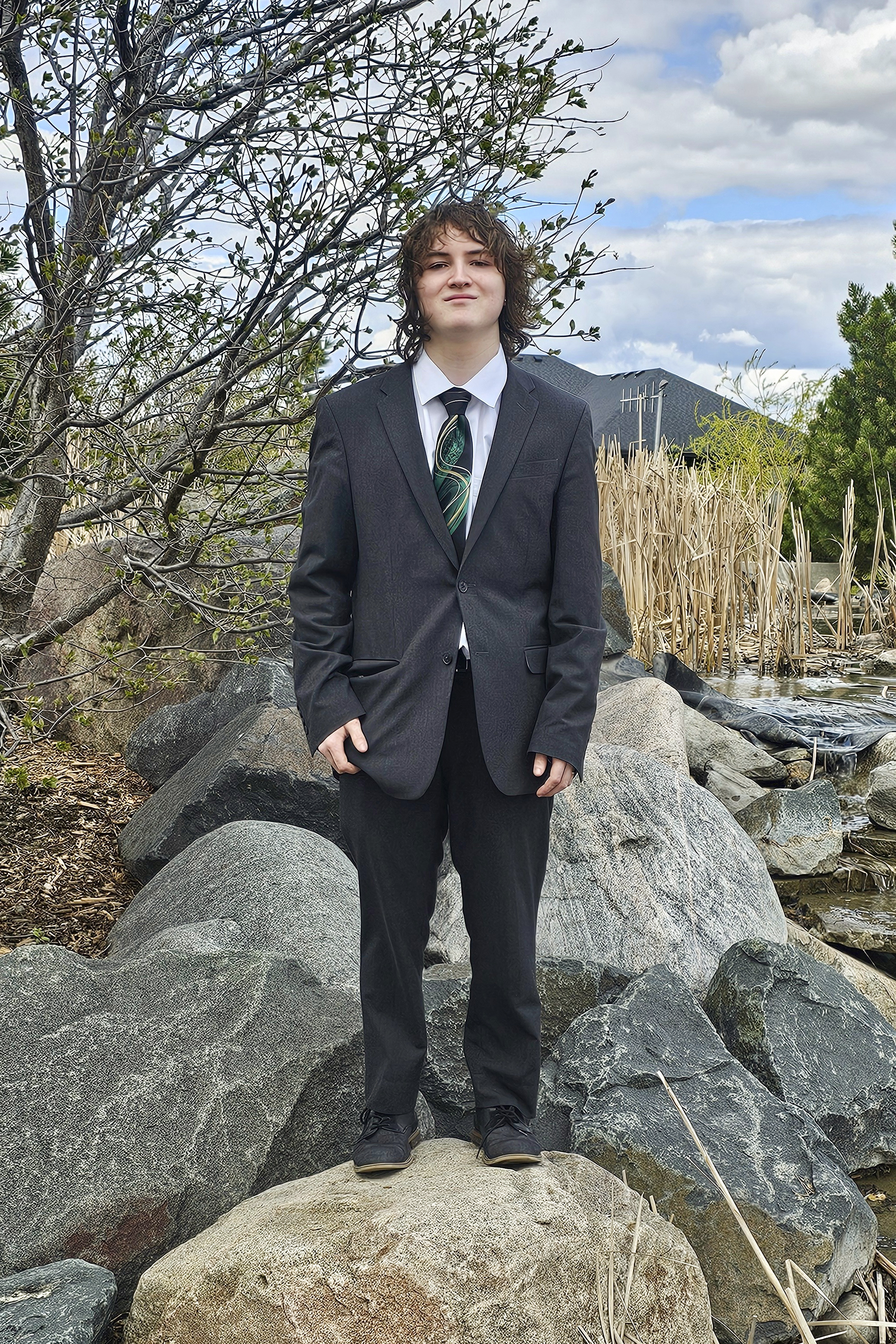 This photo provided by Catherine Dutcher shows Sam Dutcher dressed for prom in West Fargo, N.D., May 4, 2024. (Catherine Dutcher via AP)