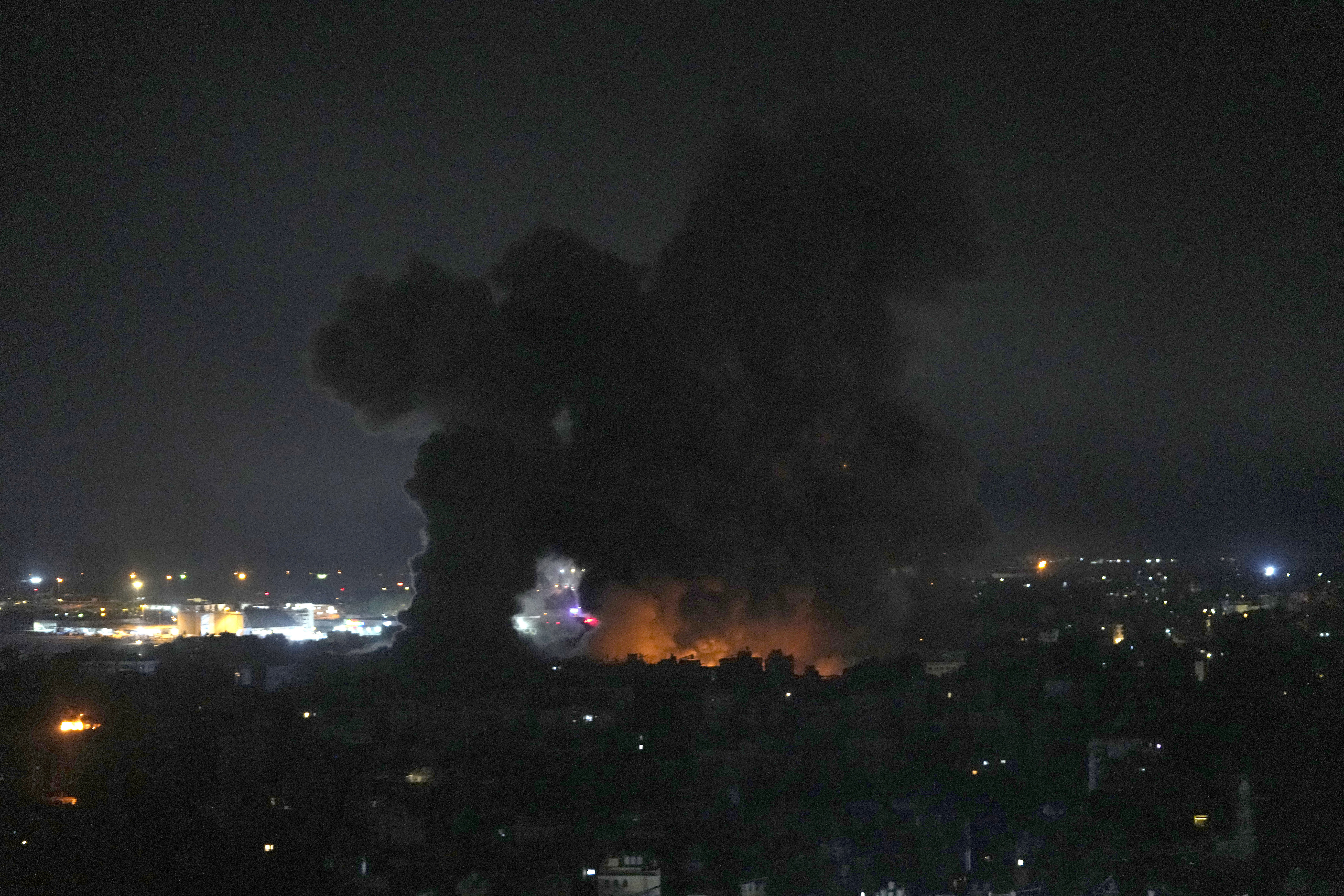 Flames and smoke rise from Israeli airstrikes in Dahiyeh, Beirut, Lebanon, Friday, Oct. 4, 2024. (AP Photo/Hussein Malla)