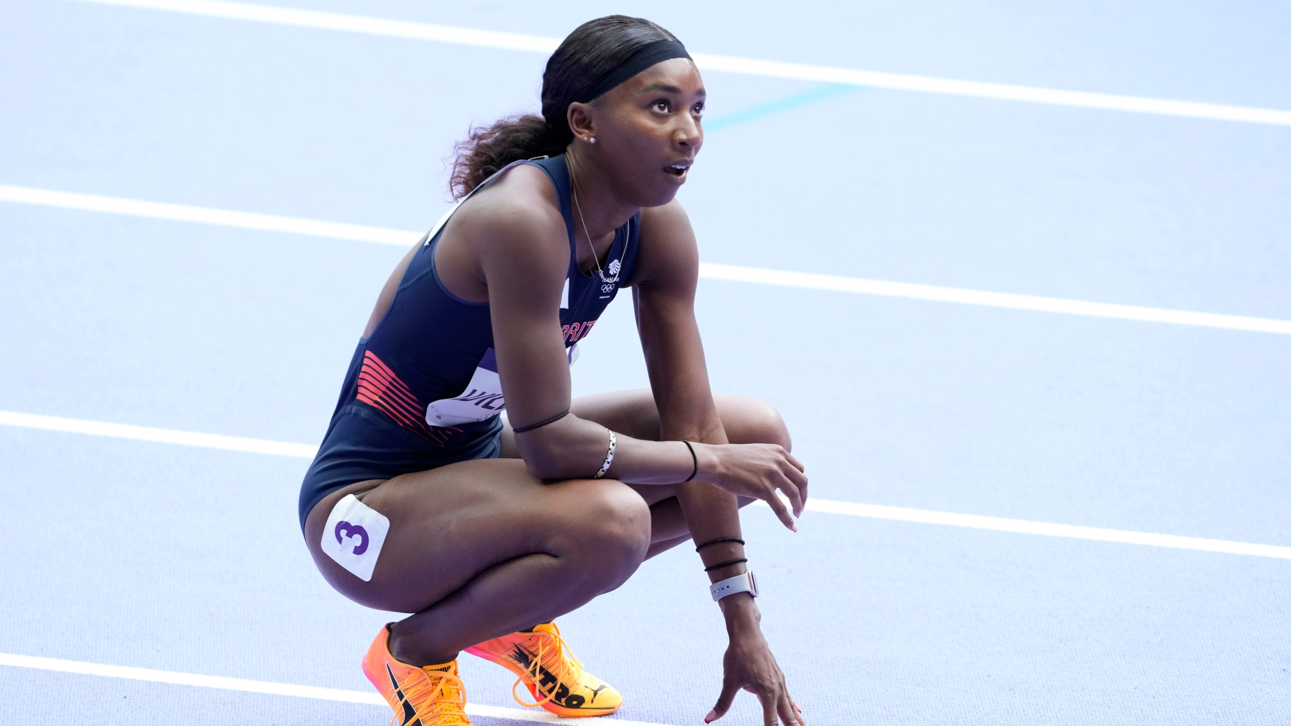 FILE - Bianca Williams, of Britain, looks up at the results after qualifying in a women's 200 meters round 1 heat at the 2024 Summer Olympics, Sunday, Aug. 4, 2024, in Saint-Denis, France. (AP Photo/Martin Meissner, File)