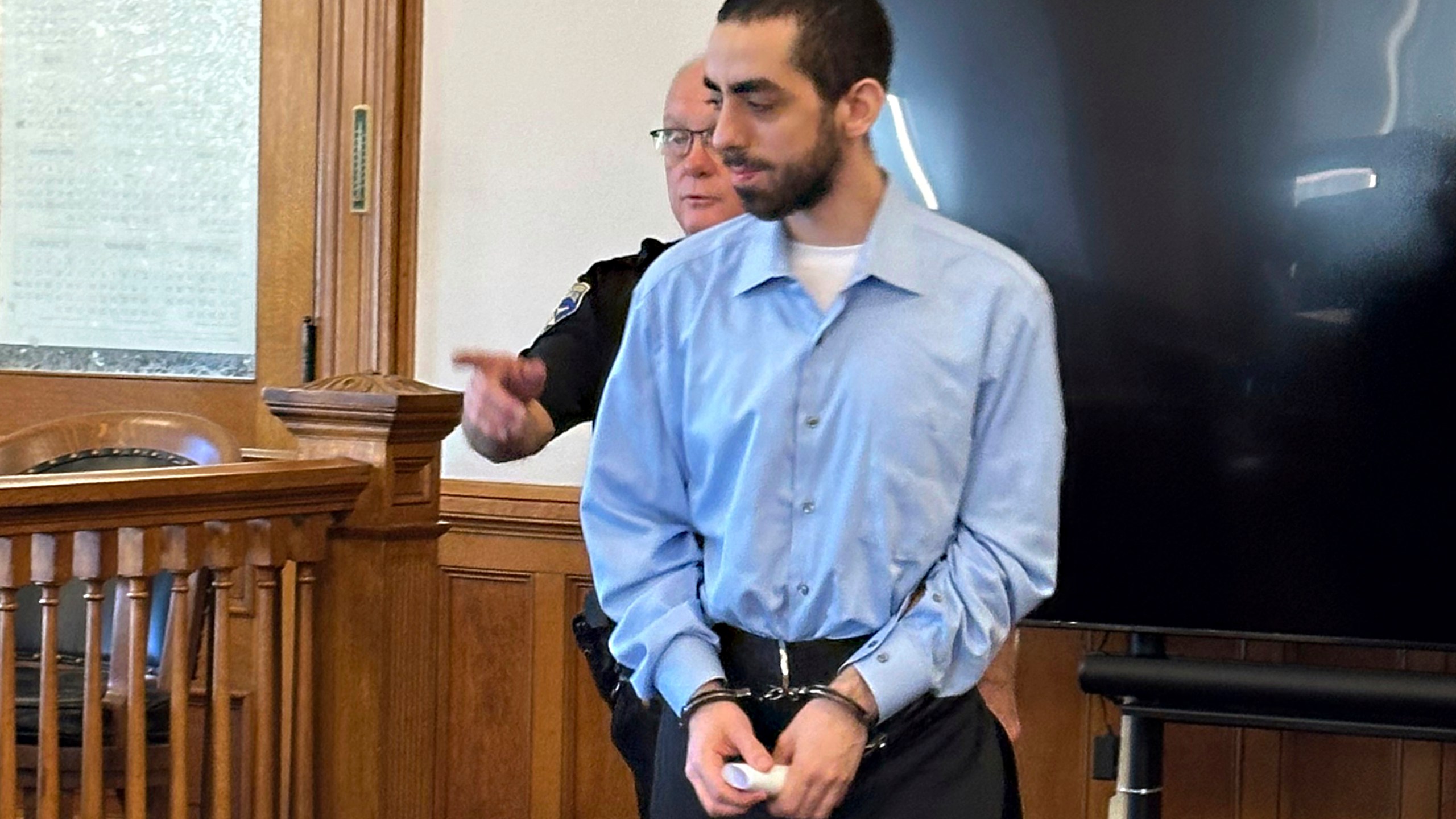 Had Matar, charged with attempted murder for stabbing author Salman Rushdie more than a dozen times, is escorted into the courtroom for a hearing in Chautauqua County Court, Friday, Oct. 4, 2024, in Mayville, N.Y. (AP Photo/Carolyn Thompson)