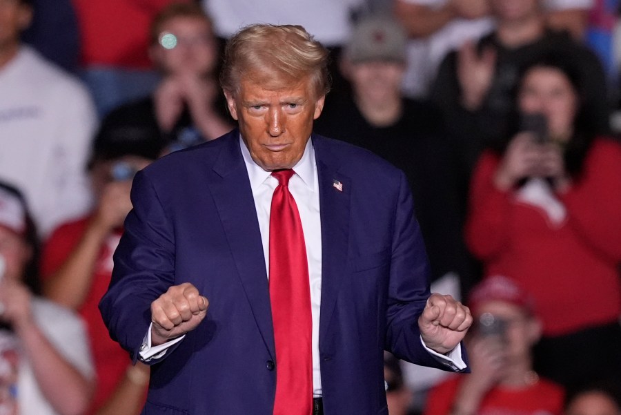 Republican presidential nominee former President Donald Trump dances at a campaign event at the Ryder Center at Saginaw Valley State University, Thursday, Oct. 3, 2024, in University Center, Mich. (AP Photo/Carlos Osorio)