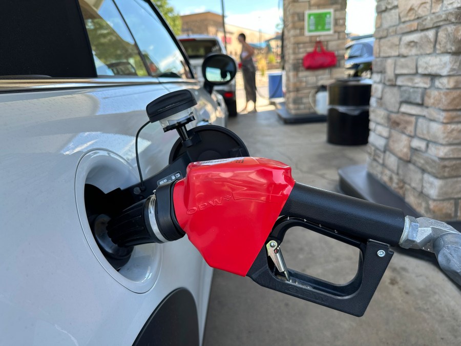 FILE - A motorist fills up the gasoline tank of a vehicle at a Costco warehouse Aug. 22, 2024, in Parker, Colo. (AP Photo/David Zalubowski, File)