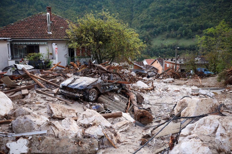 A damaged car is seen after flood hit the village of Donja Jablanica, Bosnia, Saturday, Oct. 5, 2024. (AP Photo/Armin Durgut)