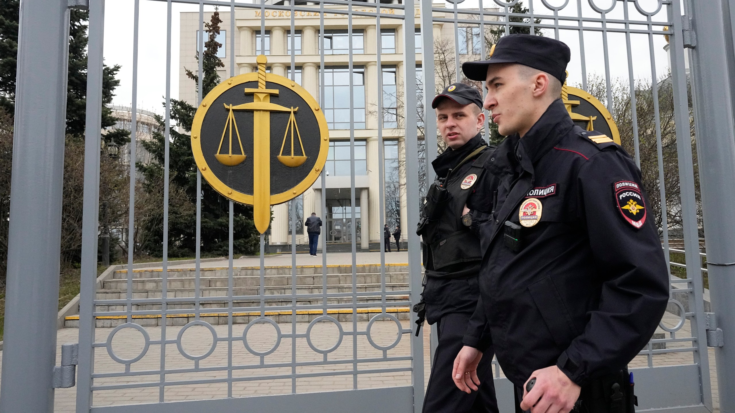 FILE - Police officers guard the Moscow City Court entrance, in Moscow, Russia, Monday, April 17, 2023. (AP Photo/Alexander Zemlianichenko, File)