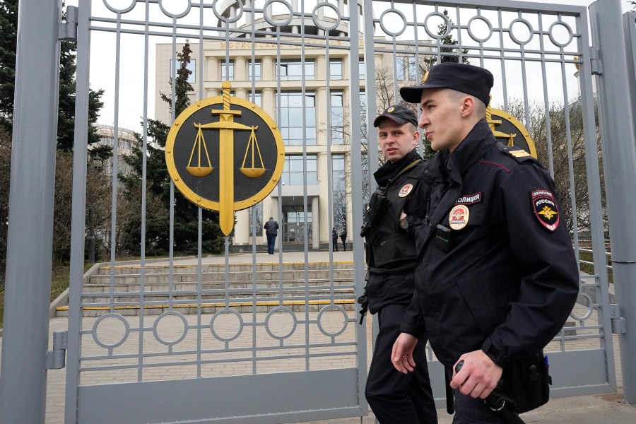 FILE - Police officers guard the Moscow City Court entrance, in Moscow, Russia, Monday, April 17, 2023. (AP Photo/Alexander Zemlianichenko, File)