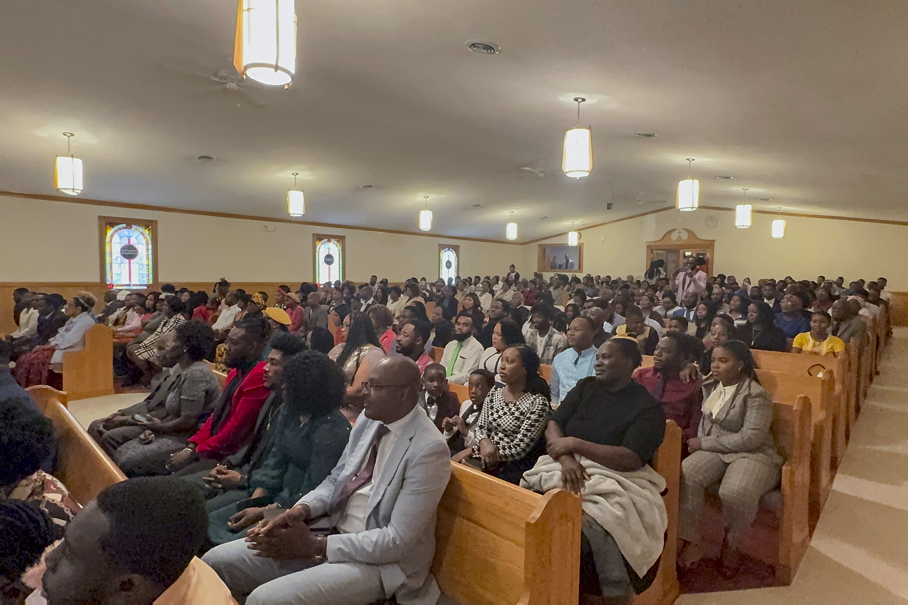 Congregants attend Eglise Porte Etroite, a Creole-language church which has gone from seven attendees to close to 300 in under 15 years, in Albertville, Ala., Sept. 29, 2024. (AP Photo/Safiyah Riddle)