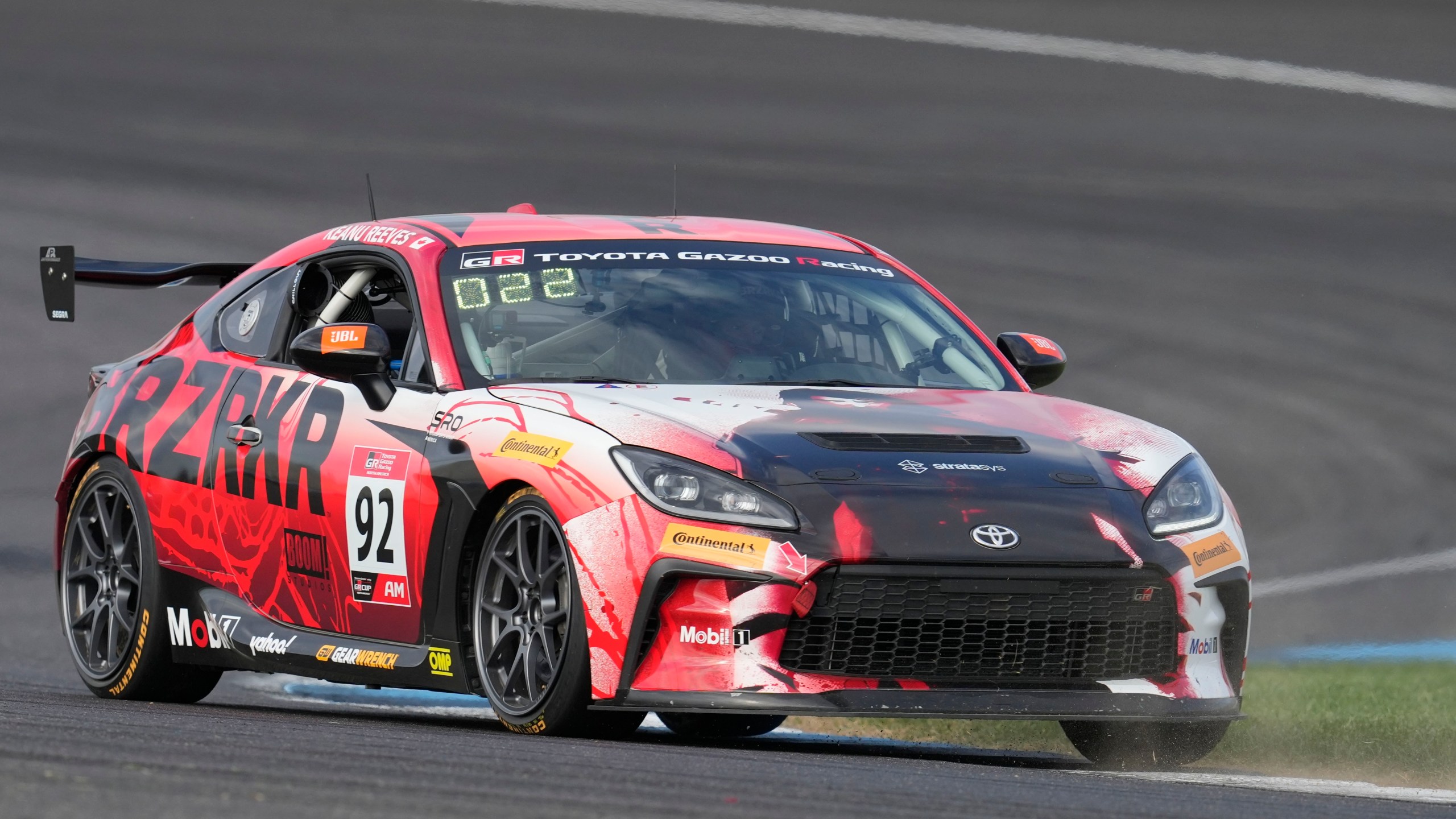 Keanu Reeves drives during the GR Cup Series auto race at Indianapolis Motor Speedway, Saturday, Oct. 5, 2024, in Indianapolis. (AP Photo/Darron Cummings)