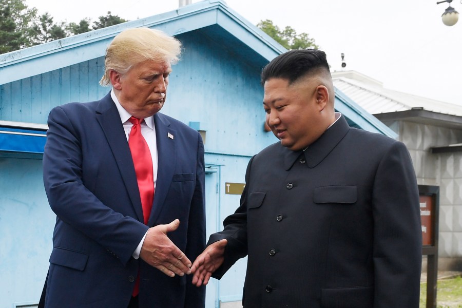 FILE - North Korean leader Kim Jong Un, right, and U.S. President Donald Trump prepare to shake hands at the border village of Panmunjom in the Demilitarized Zone, South Korea, June 30, 2019. (AP Photo/Susan Walsh, File)