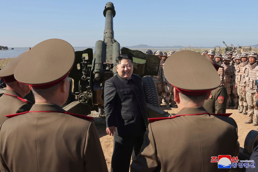 In this undated photo provided on Saturday, Oct. 6, 2024 by the North Korean government, North Korean leader Kim Jong Un, center, visits to watch an artillery exercise at an undisclosed place in North Korea. Independent journalists were not given access to cover the event depicted in this image distributed by the North Korean government. The content of this image is as provided and cannot be independently verified. Korean language watermark on image as provided by source reads: "KCNA" which is the abbreviation for Korean Central News Agency. (Korean Central News Agency/Korea News Service via AP)