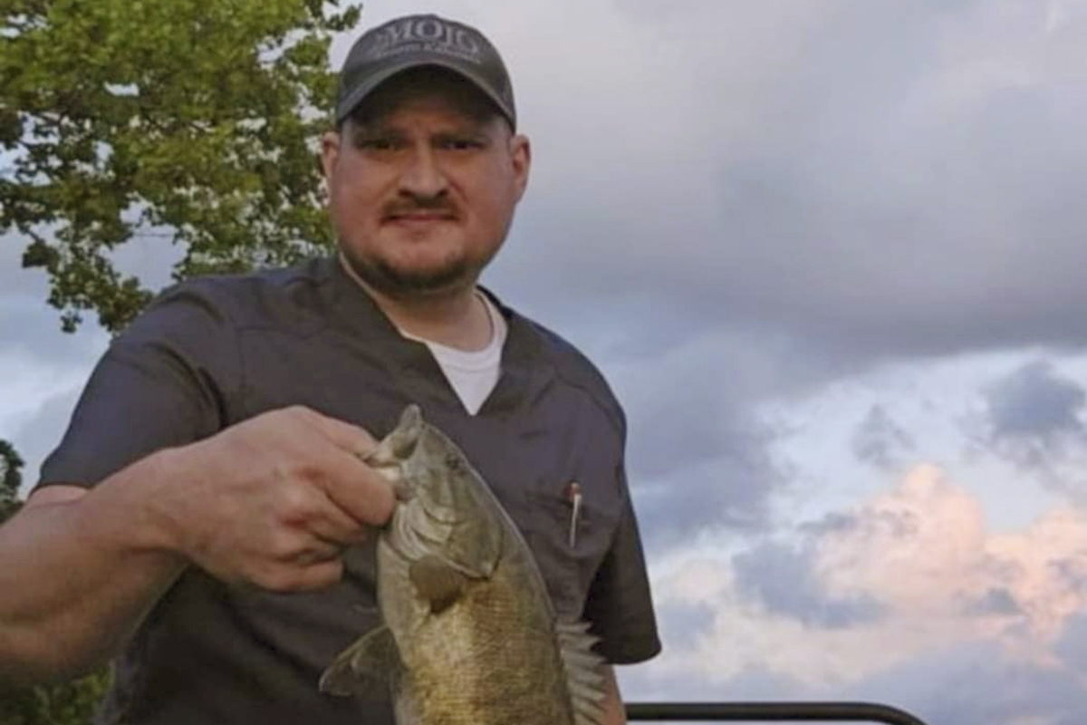 This undated photo shows Boone McCrary, of Greeneville, Tenn., who died after his boat capsized while he was trying to rescue a man trapped in the river during Hurricane Helene. (Laura Harville via AP)