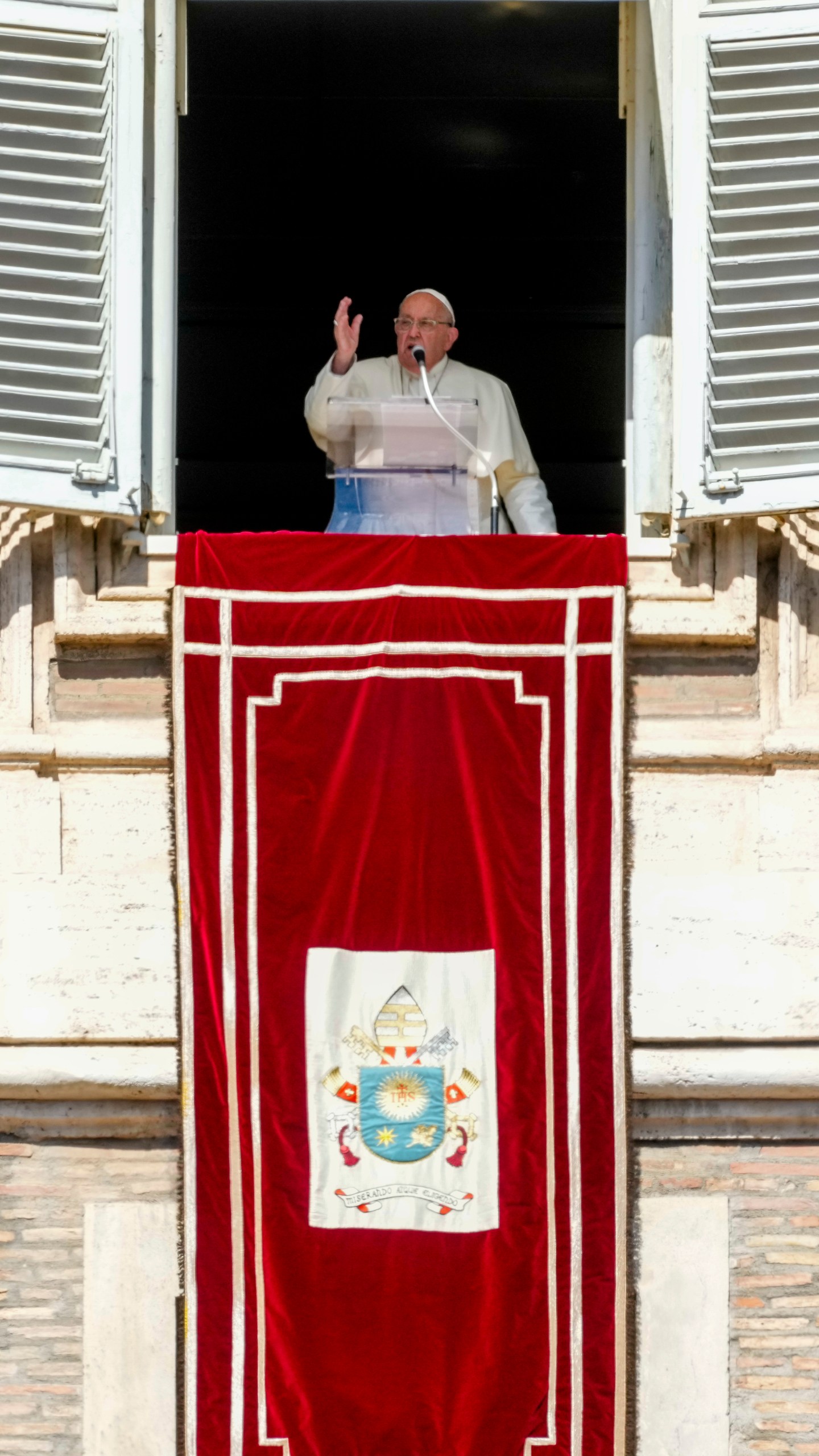 Pope Francis appears at his studio window for the traditional noon blessing of faithful and pilgrims gathered in St. Peter's Square at The Vatican, Sunday, Oct. 6, 2024. (AP Photo/Andrew Medichini)