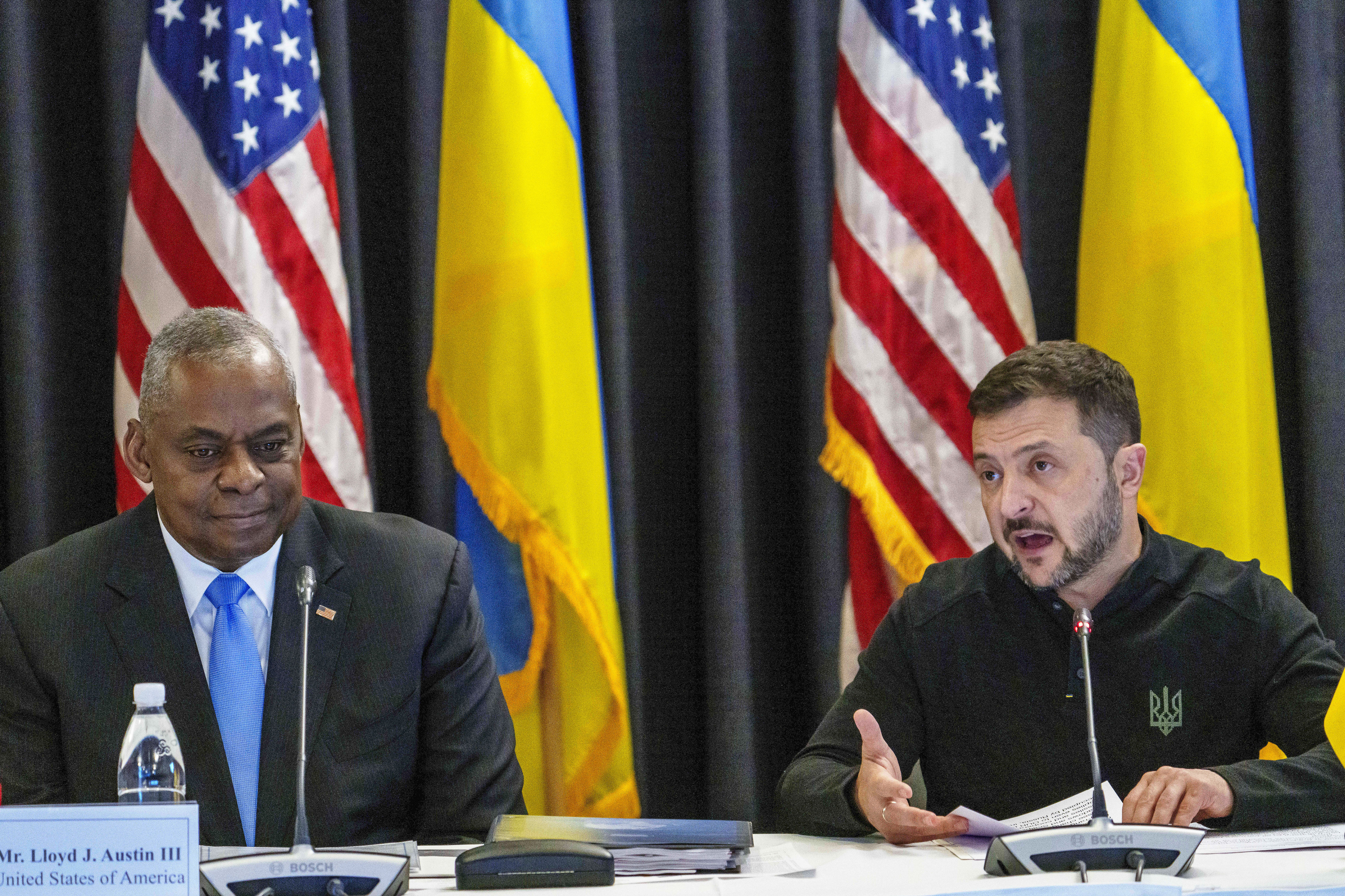 FILE - U.S. Defense Secretary Lloyd Austin, left, listens to Ukraine's President Volodymyr Zelenskyy during a meeting at Ramstein Air Base in Ramstein-Miesenbach, Germany, Friday, Sept. 6, 2024. (Andreas Arnold/dpa via AP, File)