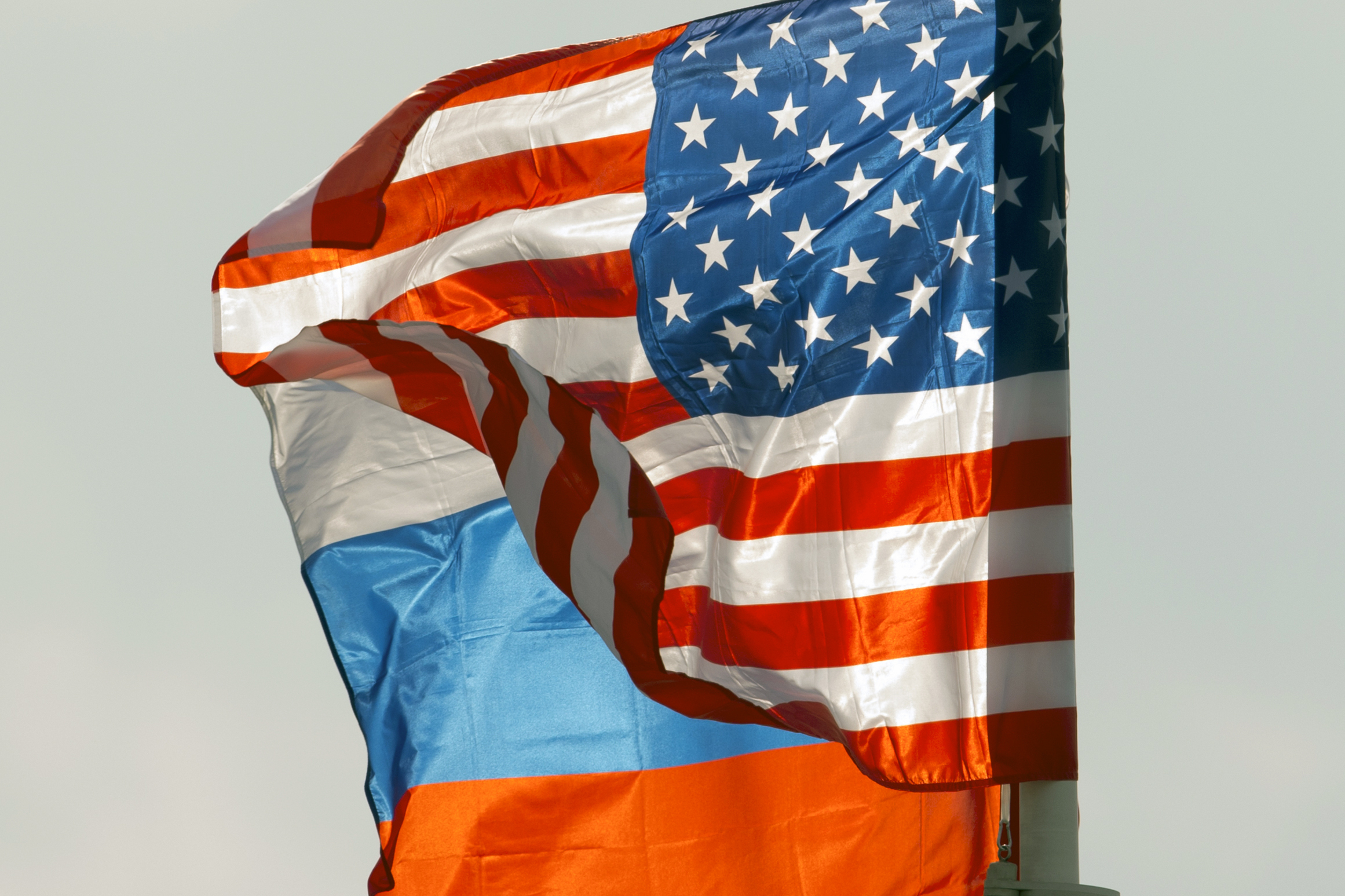 FILE - U.S. and Russian national flags wave on the wind in Moscow's Vnukovo airport, Russia, April 11, 2017 to welcome a U.S. dignitary. (AP Photo/ Ivan Sekretarev, file)