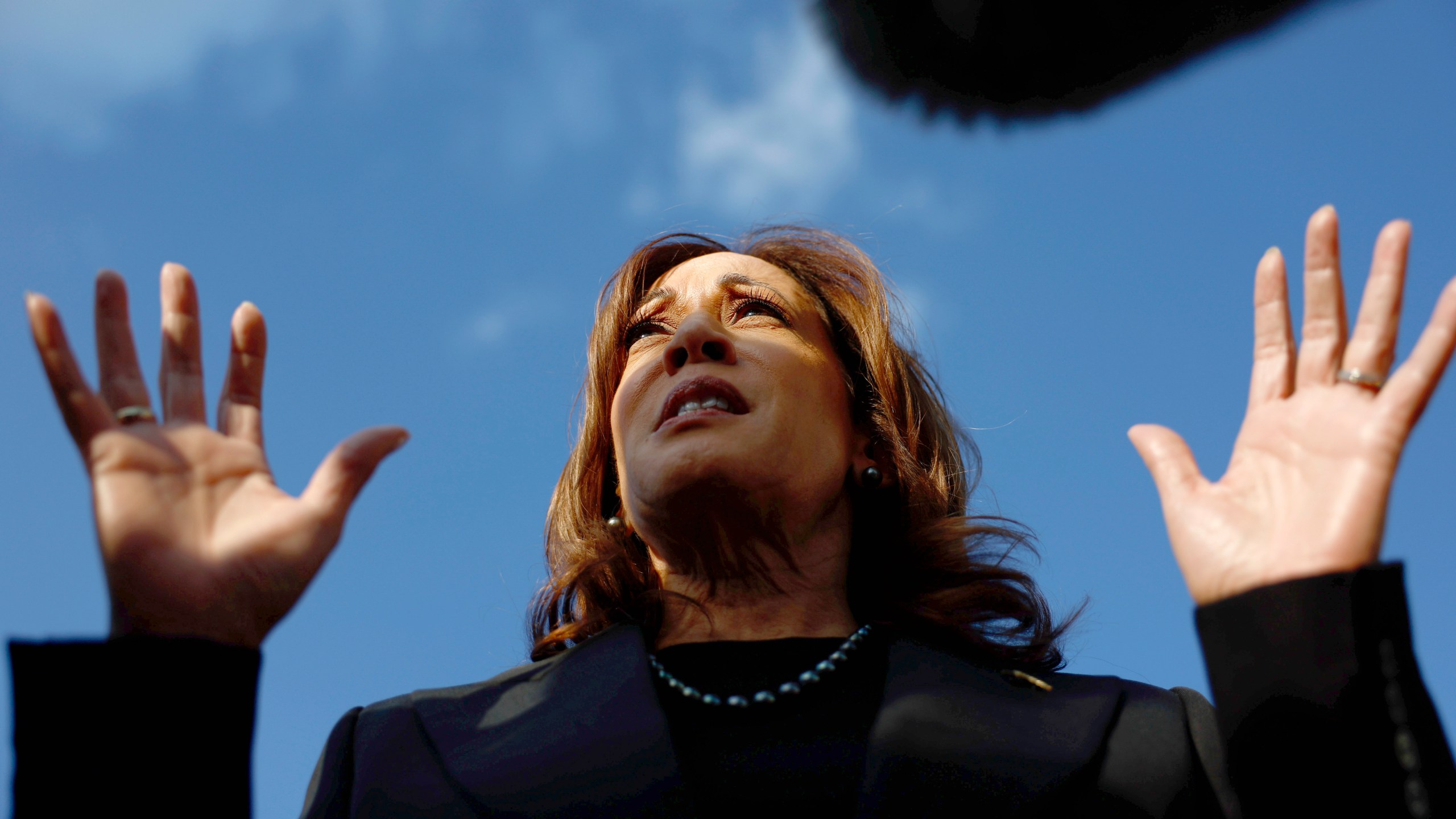 Democratic presidential nominee Vice President Kamala Harris speaks to reporters before boarding Air Force Two to depart for New York at Joint Base Andrews, Md., Monday, Oct. 7, 2024. (Evelyn Hockstein/Pool via AP)