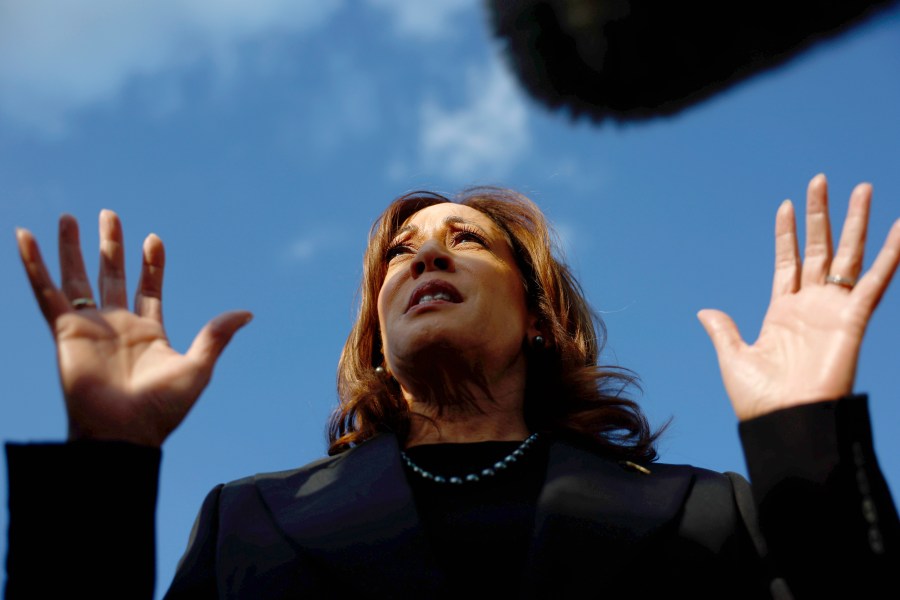 Democratic presidential nominee Vice President Kamala Harris speaks to reporters before boarding Air Force Two to depart for New York at Joint Base Andrews, Md., Monday, Oct. 7, 2024. (Evelyn Hockstein/Pool via AP)