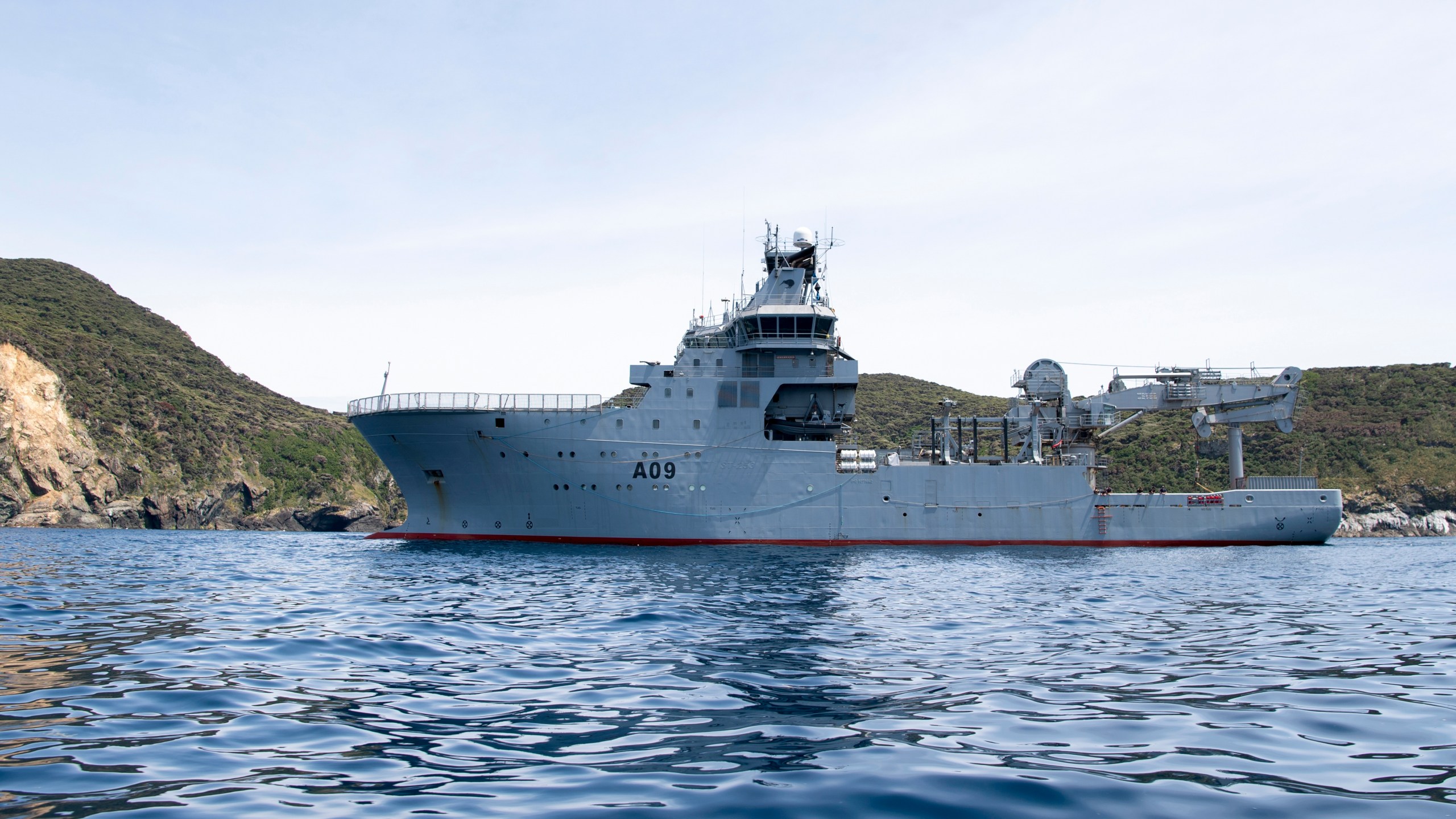 This image released by New Zealand Defence Force (NZDF), shows HMNZS Manawanui at the Three Kings islands off the coast New Zealand, on Dec. 1, 2023. (Petty Officer Chris Weissenborn/NZDF via AP)