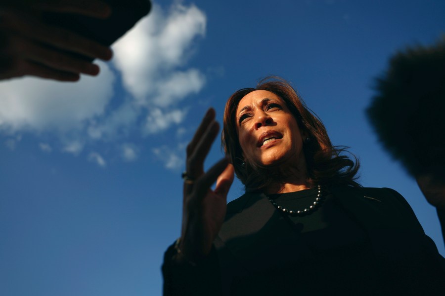 Democratic presidential nominee Vice President Kamala Harris speaks to reporters before boarding Air Force Two to depart for New York at Joint Base Andrews, Md., Monday, Oct. 7, 2024. (Evelyn Hockstein/Pool via AP)