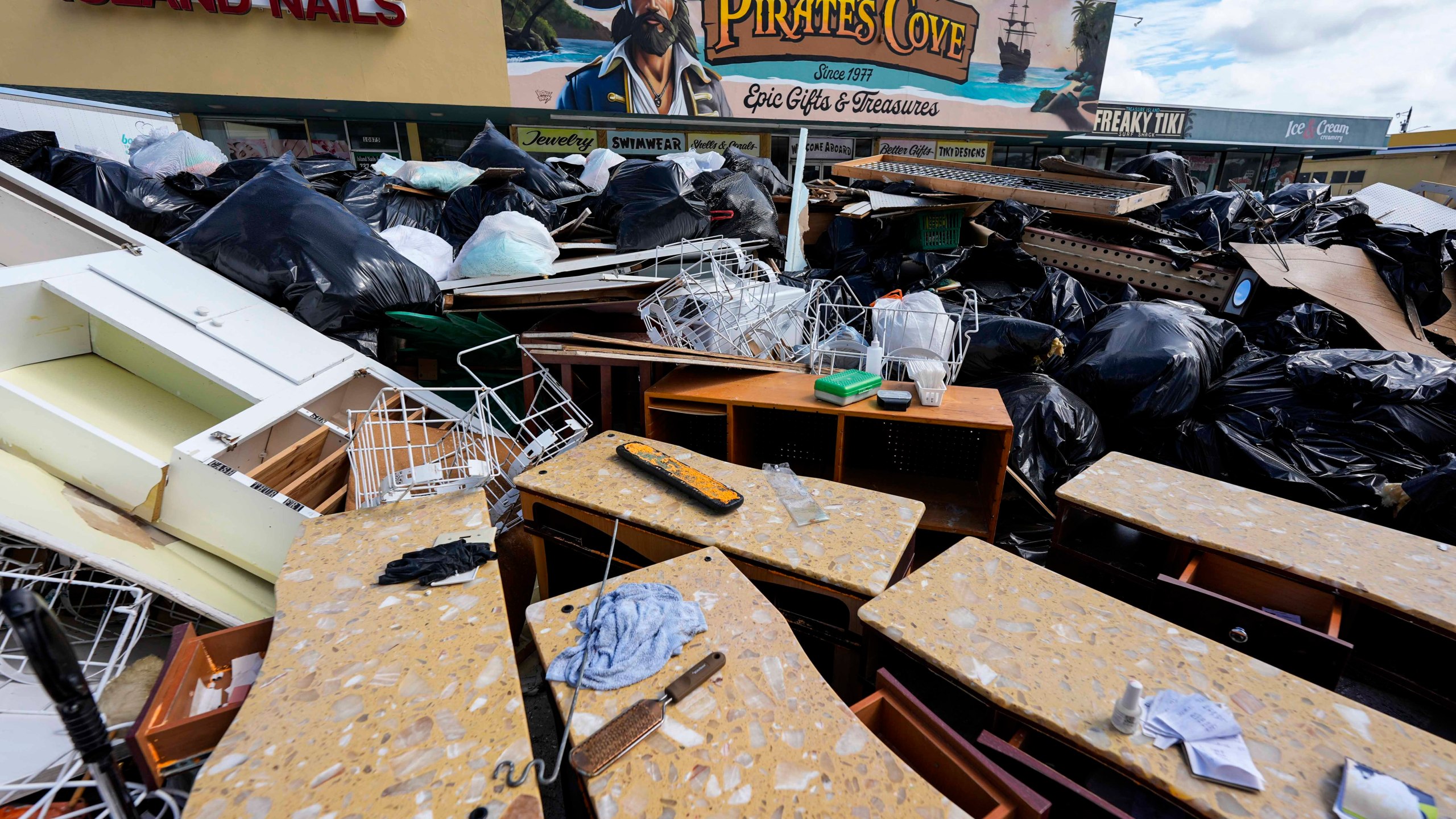 A closed business is seen after Hurricane Helene ahead of Hurricane Milton's arrival, Tuesday, Oct. 8, 2024, in Treasure Island, Fla. (AP Photo/Mike Stewart)