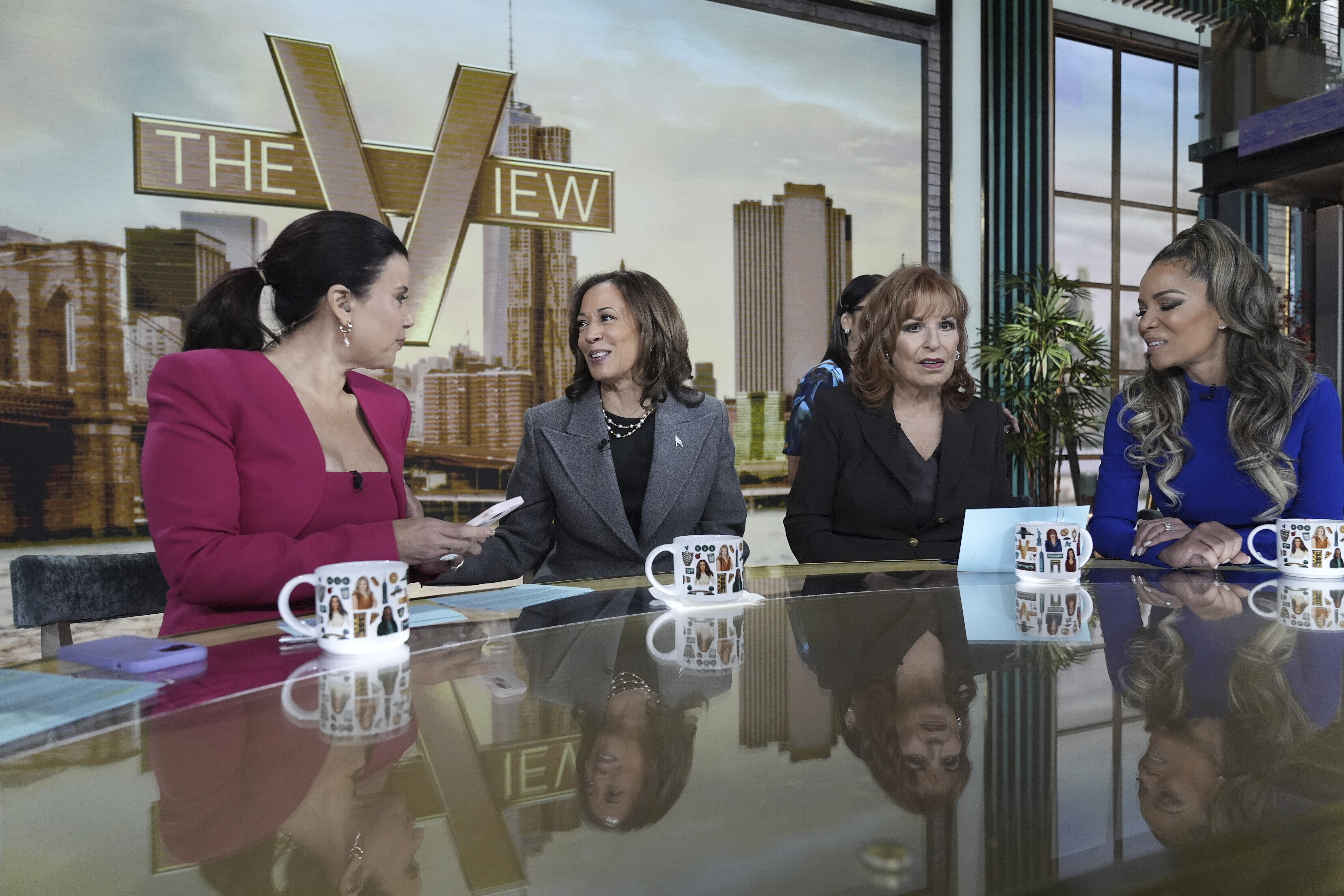 Democratic presidential nominee Vice President Kamala Harris chats with the hosts during a commercial break at The View, Tuesday, Oct. 8, 2024, in New York. Seated from left are Ana Navarro, Harris, Joy Behar and Sunny Hostin. (AP Photo/Jacquelyn Martin)