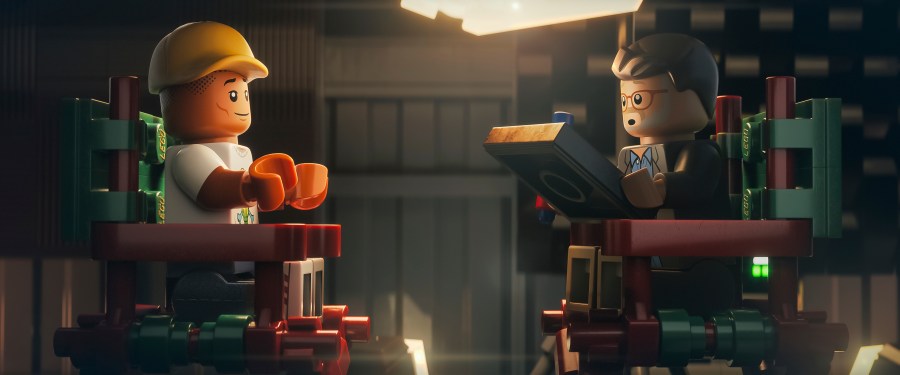 This image released by Focus Features shows lego characters Pharrell Williams, left, and director Morgan Neville in a scene from "Piece By Piece." (Focus Features via AP)