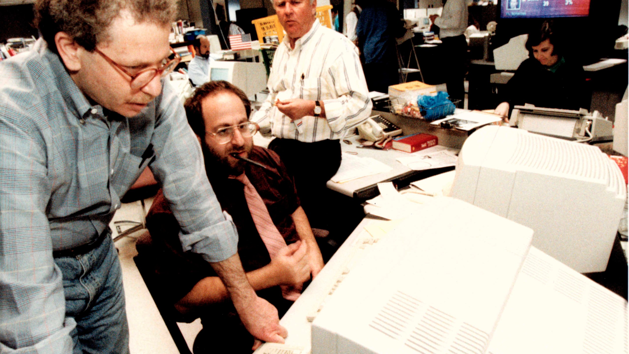 FILE - Associated Press journalists David Espo, bureau chief Jonathan Wolman and Walter Mears work on Election Day, November 1992, in Washington. (AP Photo, File)