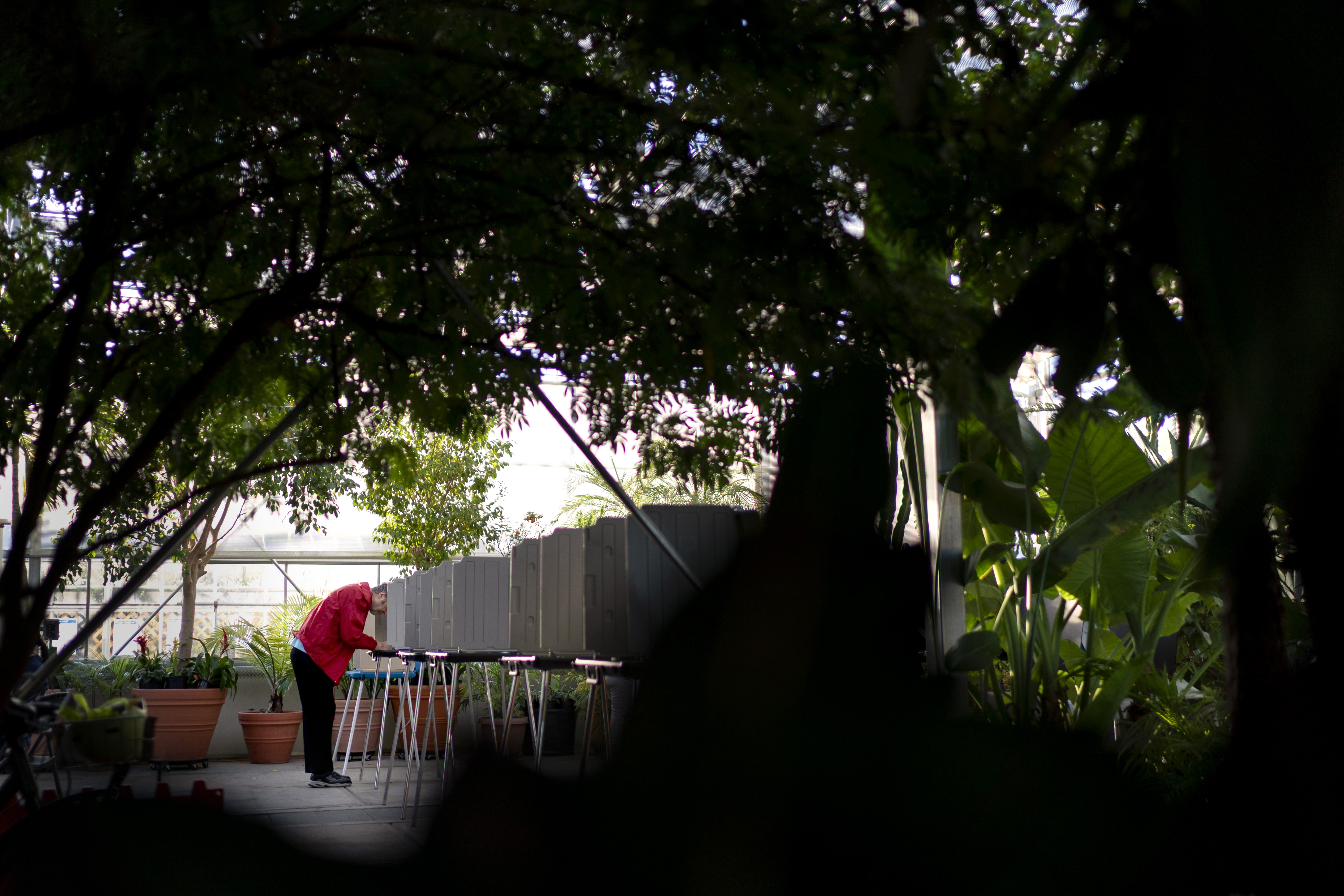 FILE - A voter marks a ballot for the midterm election at a polling site at the Roger Williams Park Botanical Center in Providence, R.I., Tuesday, Nov. 8, 2022. (AP Photo/David Goldman, File)