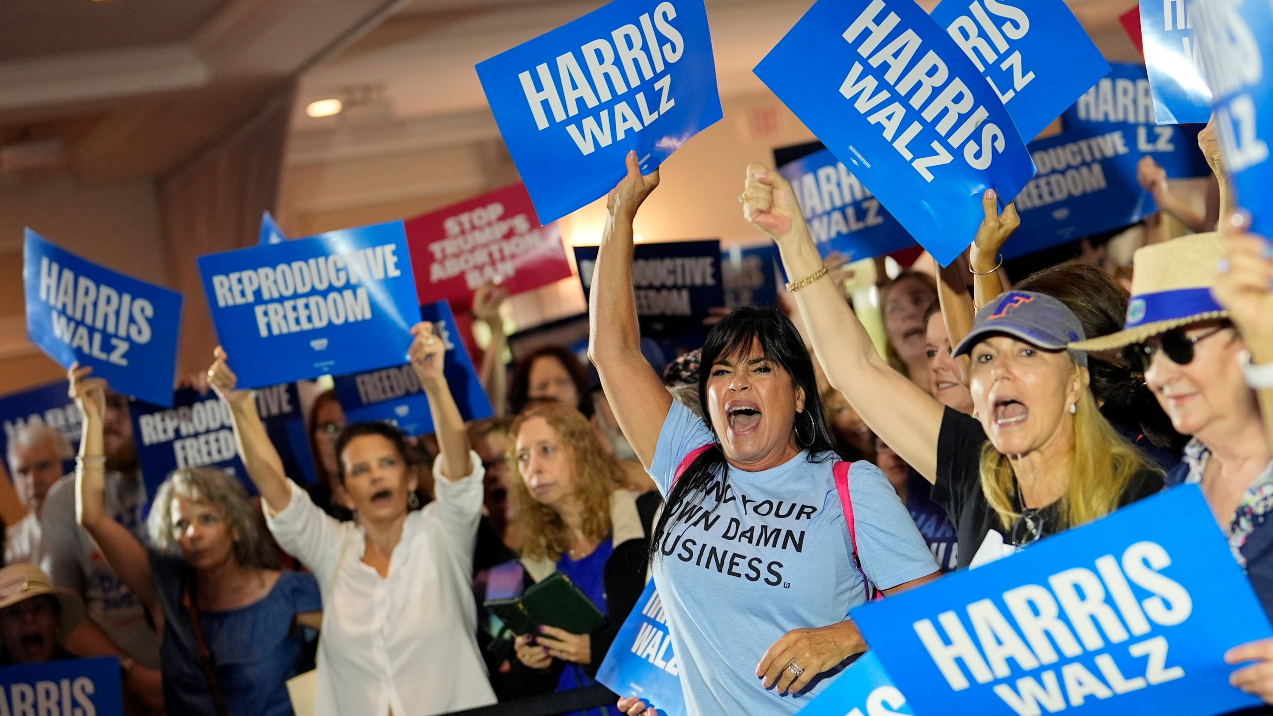 FILE - Supporters cheer as speakers arrive at an event kicking off a national "Reproductive Freedom Bus Tour" by the campaign of Democratic presidential nominee Vice President Kamala Harris and running mate Gov. Tim Walz, Sept. 3, 2024, in Boynton Beach, Fla. (AP Photo/Rebecca Blackwell, File)