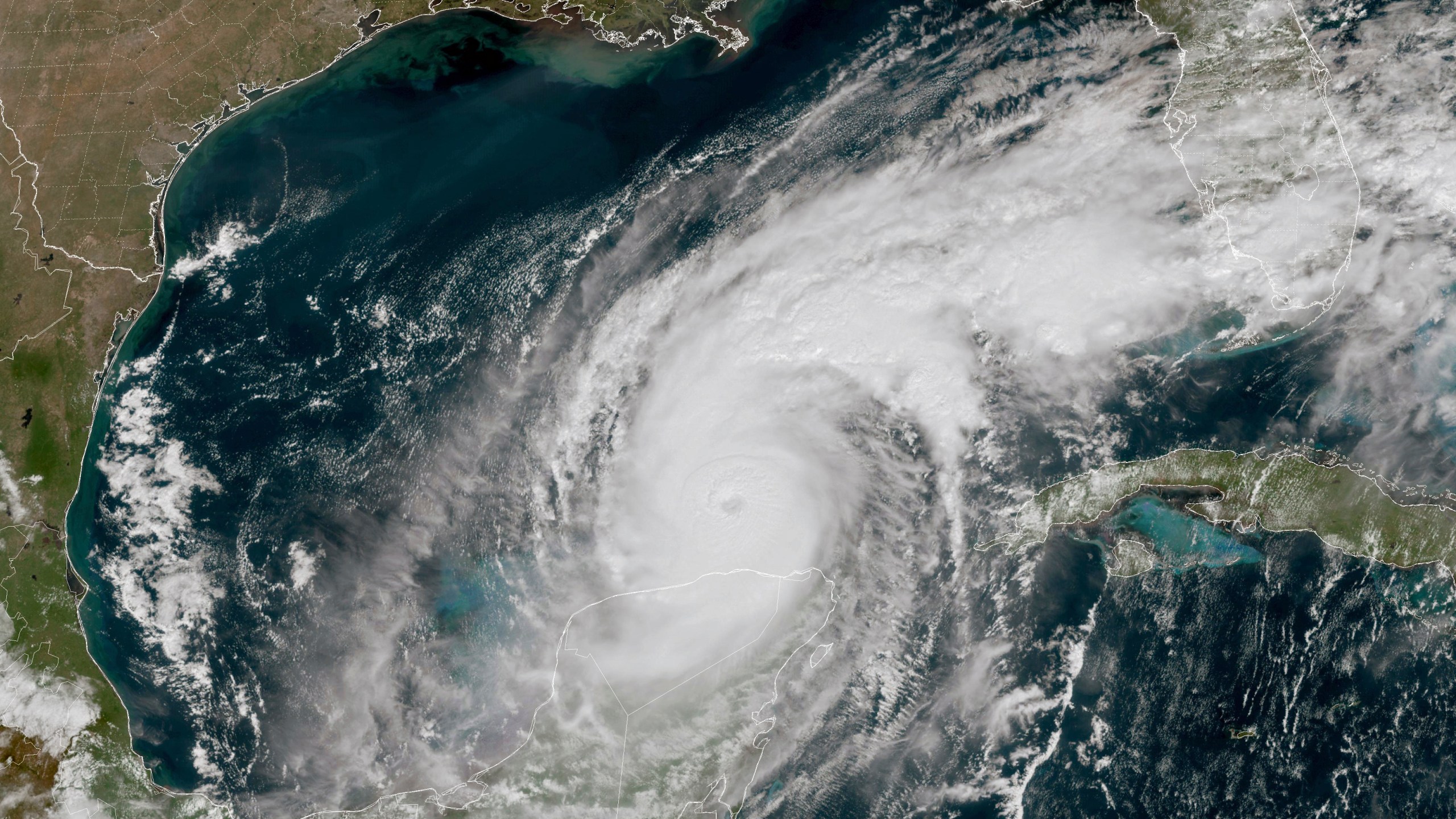 This GOES-16 GeoColor satellite image taken at 12:15 p.m. EDT and provided by National Oceanic and Atmospheric Administration (NOAA) shows Hurricane Milton in the Gulf of Mexico, off the coast off Mexico’s Yucatan Peninsula Tuesday, Oct. 8, 2024. (NOAA via AP)