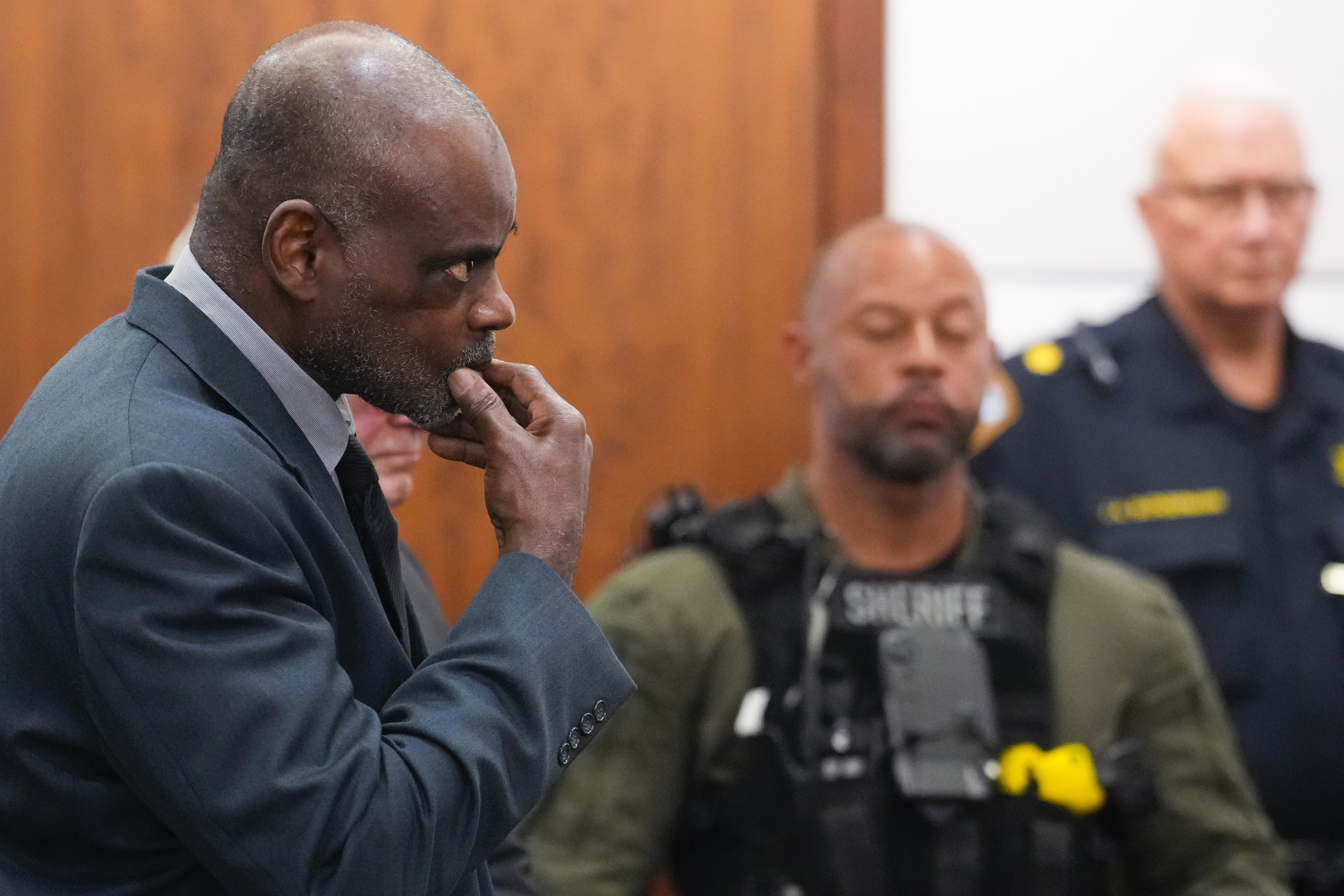 Former Houston Police officer Gerald Goines stands as he is formally sentenced on a pair of felony murder convictions on Tuesday, Oct. 8, 2024, in Houston. Goines was found guilty of felony murder and sentenced to 60 years behind bars in the 2019 deaths of Dennis Tuttle and Rhogena Nicholas. (Brett Coomer/Houston Chronicle via AP)