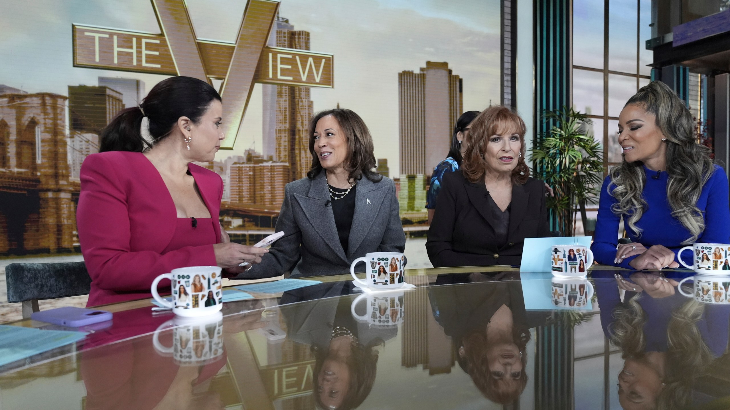 Democratic presidential nominee Vice President Kamala Harris chats with the hosts during a commercial break at The View, Tuesday, Oct. 8, 2024, in New York. Seated from left are Ana Navarro, Harris, Joy Behar and Sunny Hostin. (AP Photo/Jacquelyn Martin)