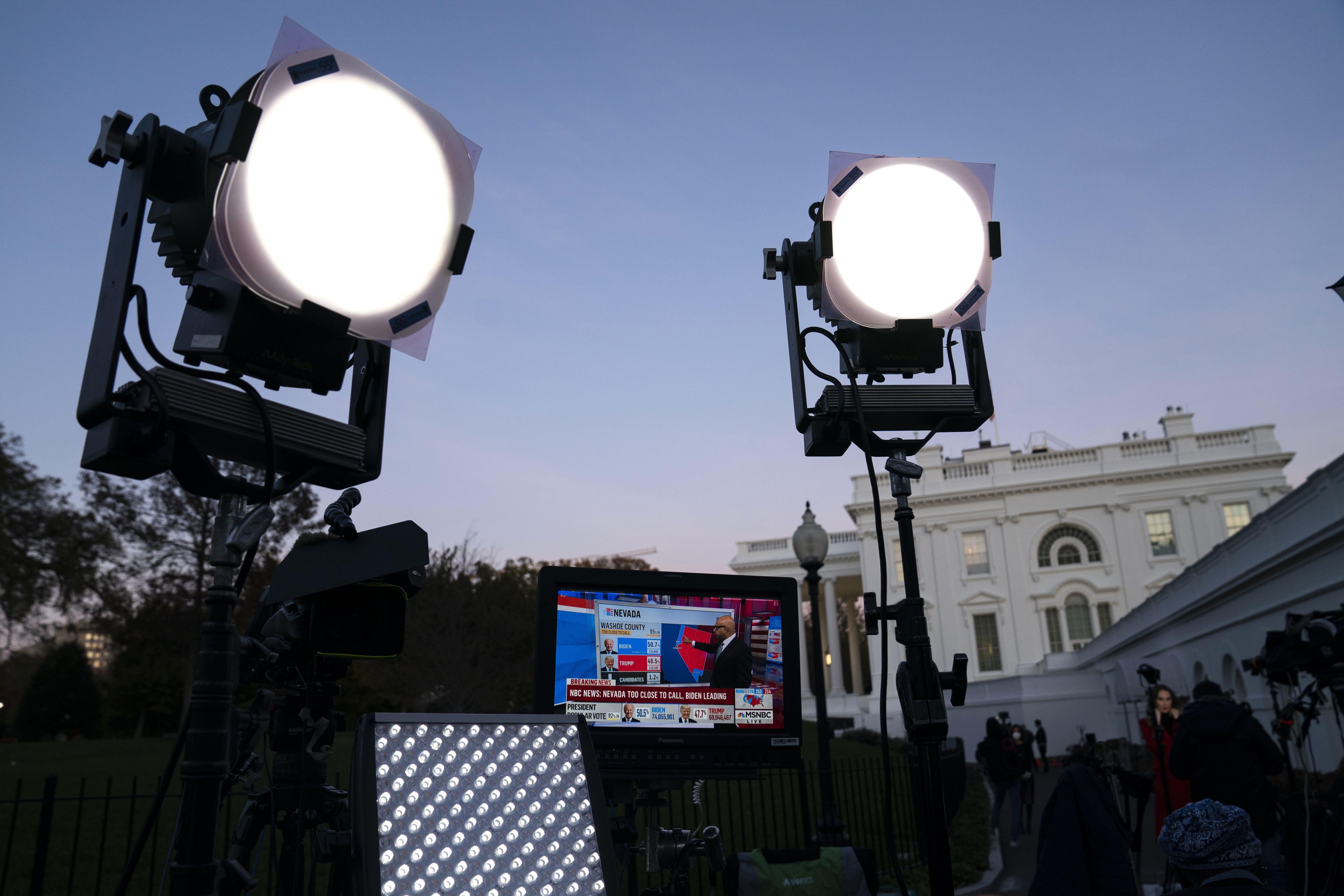 FILE - Media organizations set up outside the White House, Friday, Nov. 6, 2020, in Washington. (AP Photo/Evan Vucci, File)