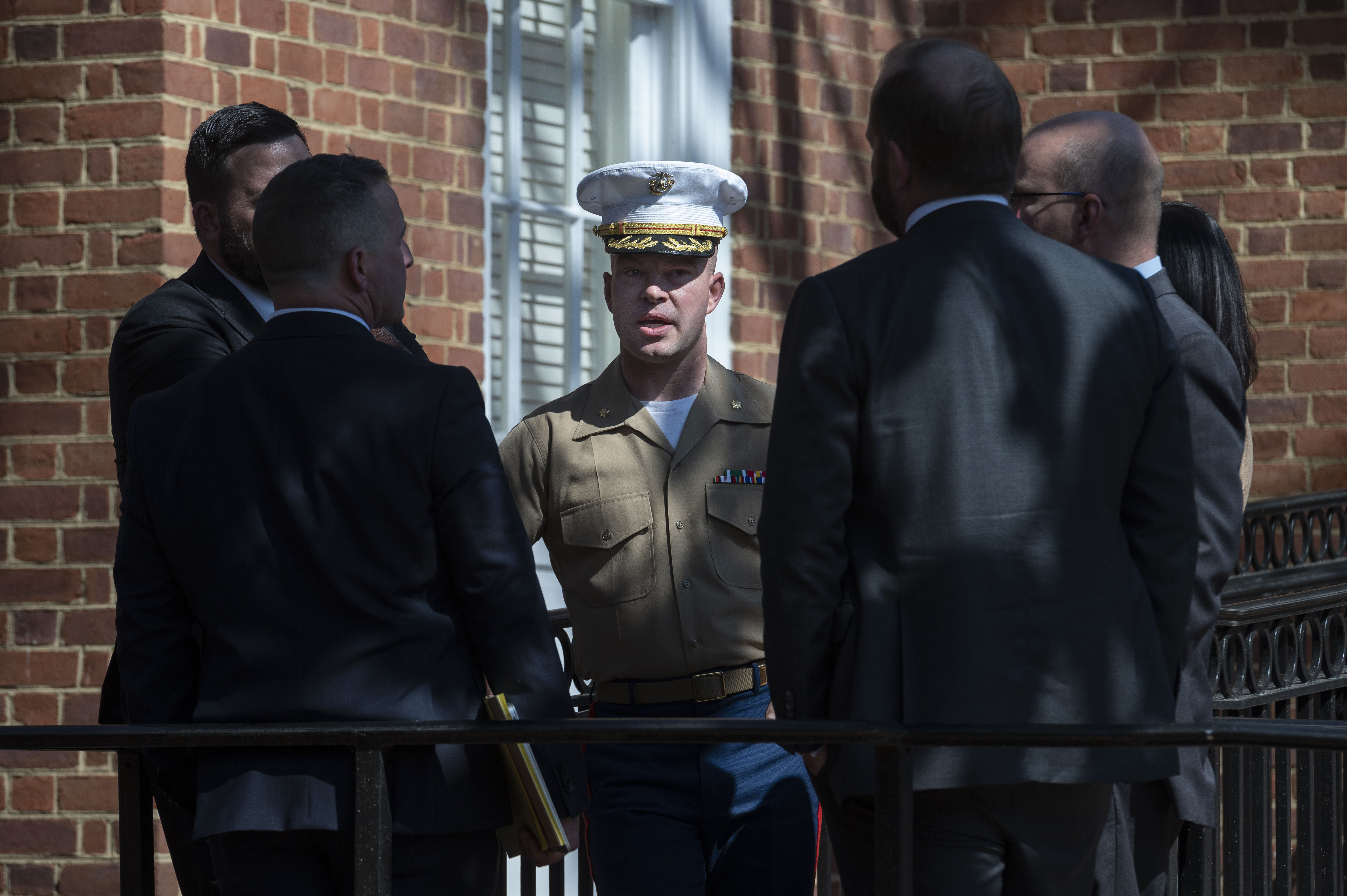 FILE - U.S. Marine Corp Major Joshua Mast, center, talks with his attorneys during a break in a hearing in an ongoing custody battle over an Afghan orphan, at the Circuit Courthouse in Charlottesville, Va., March 30, 2023. (AP Photo/Cliff Owen, File)