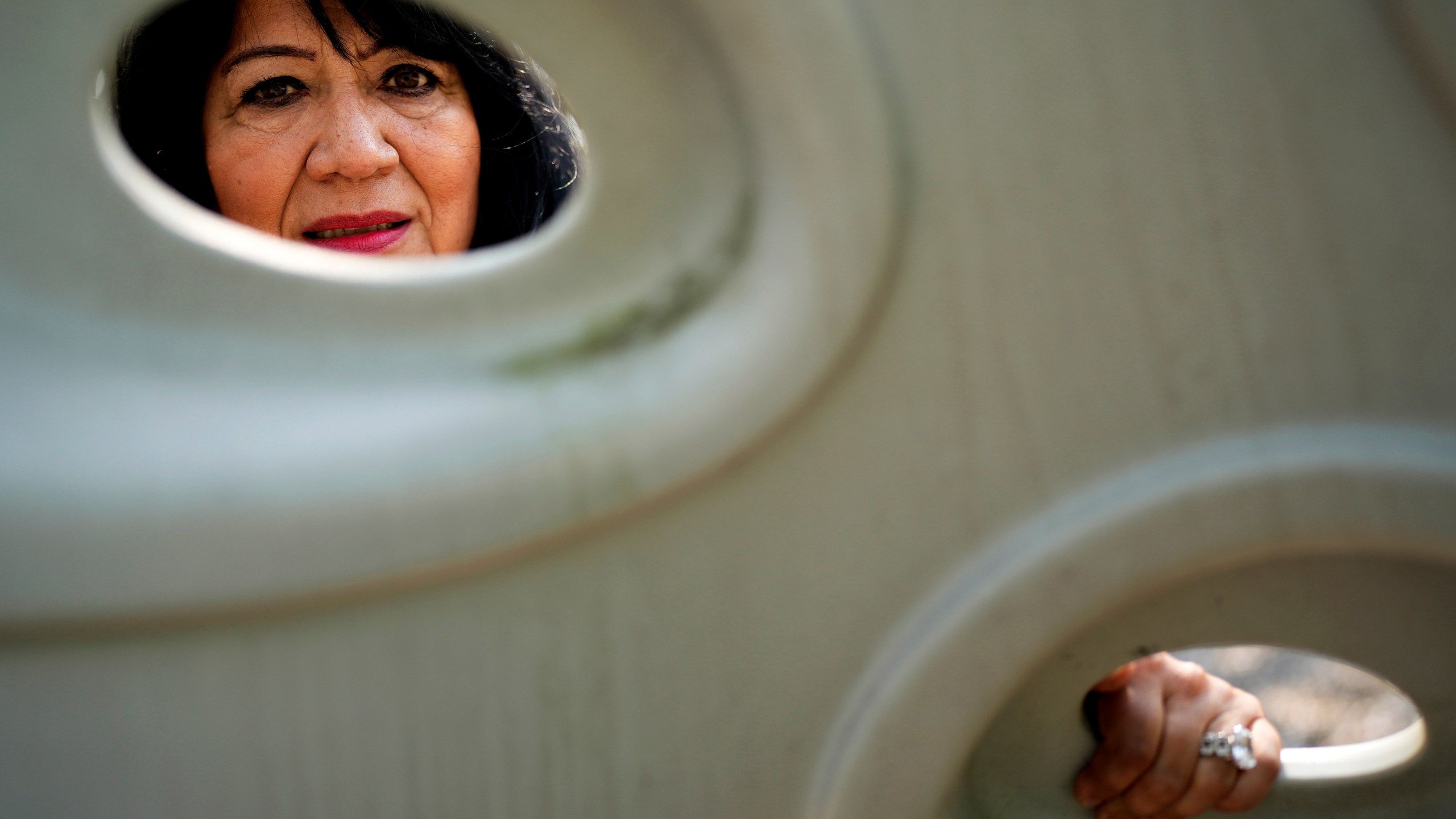 Margaret Padilla Carrasco, 65, who has lived in Waukegan her entire life, poses for a photo in Waukegan, Ill., Monday, Sept. 17, 2024. (AP Photo/Nam Y. Huh)