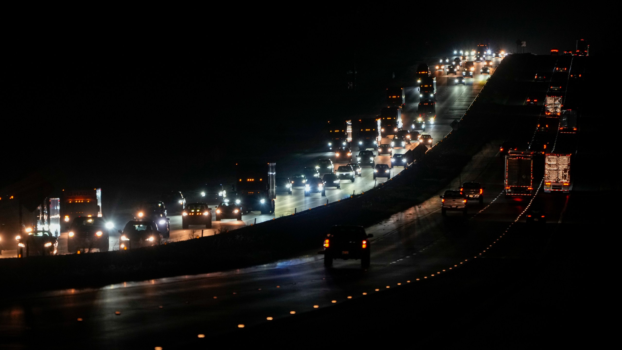 Heavy traffic flows northbound on Interstate-75 as people evacuate the Tampa Bay area ahead of Hurricane Milton's arrival late Monday, Oct. 7, 2024, in Ocala, Fla. (AP Photo/Julio Cortez)