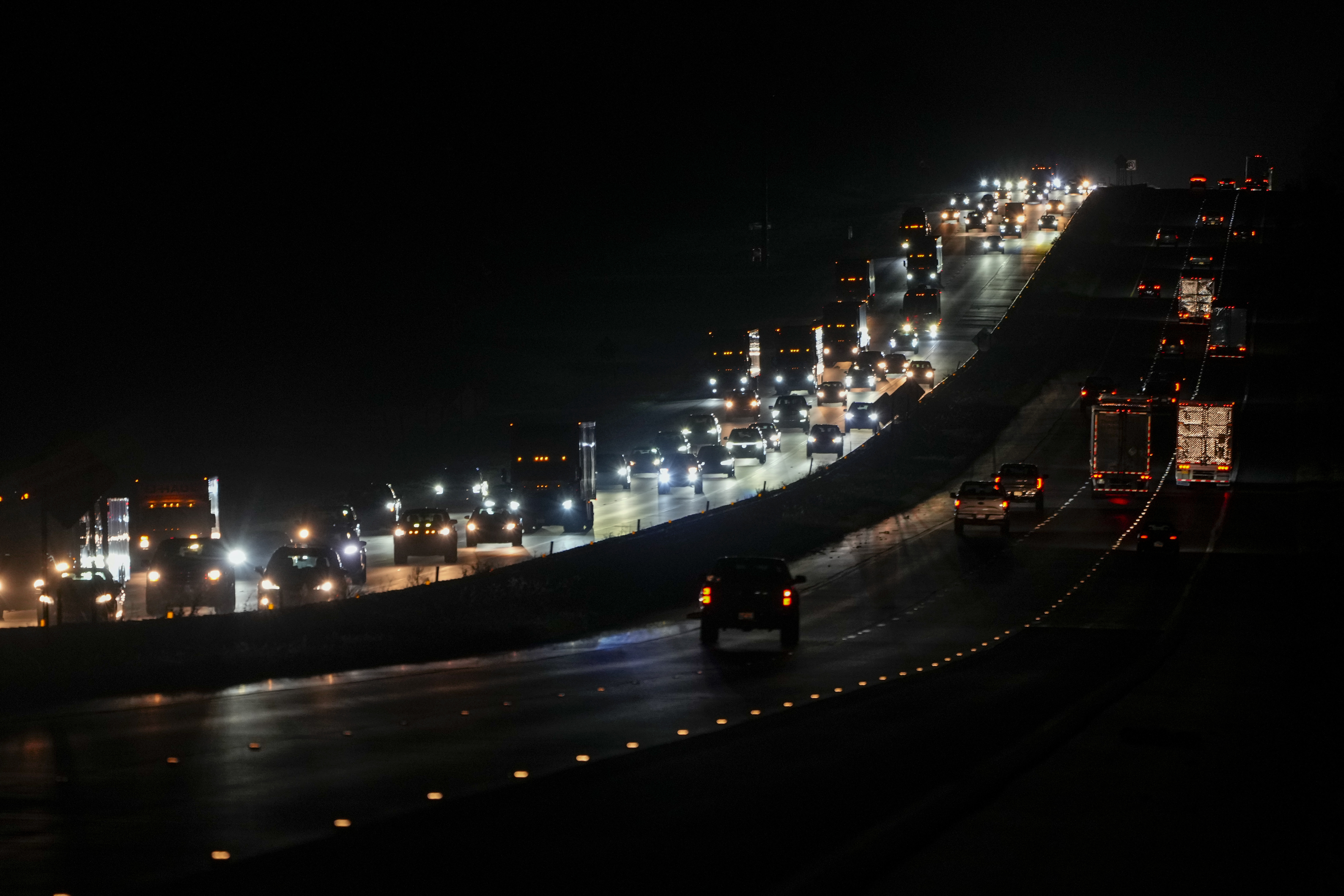 Heavy traffic flows northbound on Interstate-75 as people evacuate the Tampa Bay area ahead of Hurricane Milton's arrival late Monday, Oct. 7, 2024, in Ocala, Fla. (AP Photo/Julio Cortez)