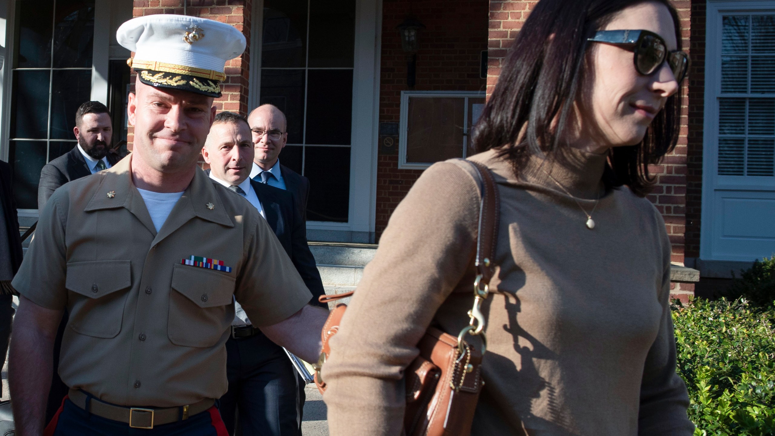 FILE - Marine Maj. Joshua Mast and his wife, Stephanie, walk out of Circuit Court, March 30, 2023 in Charlottesville, Va. A Virginia appellate court ruled Tuesday that a U.S. Marine should never have been granted an adoption of an Afghan war orphan and voided the custody order he’s relied on to raise the girl for nearly three years. The decision marked a major turning point in a bitter custody battle that has international ramifications far greater than the fate of one child. (AP Photo/Cliff Owen, File)