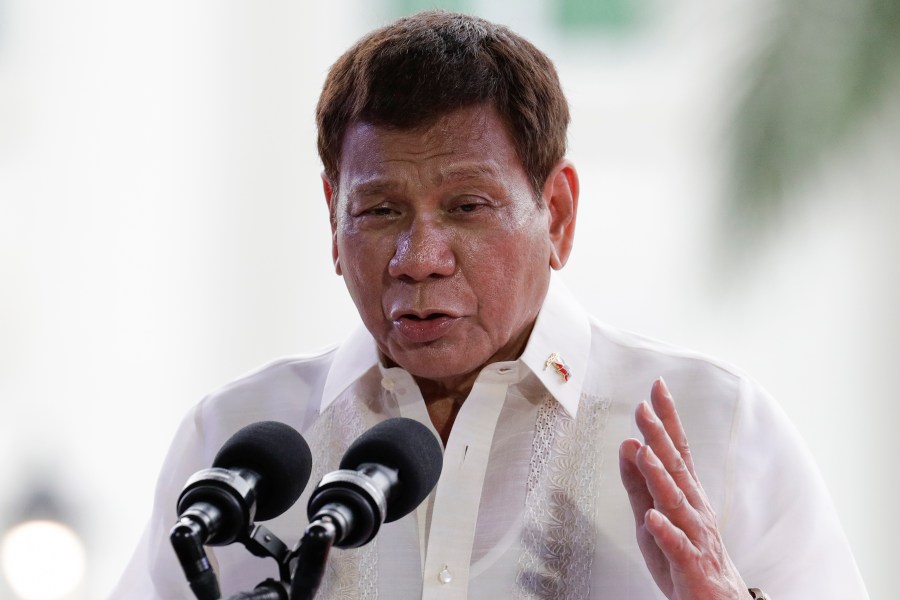 FILE - Philippine President Rodrigo Duterte gestures during a speech at the anniversary of the proclamation of the Philippine independence rites on Saturday, June 12, 2021, at the Provincial Capitol of Bulacan province, Philippines. (AP Photo/Aaron Favila, file)