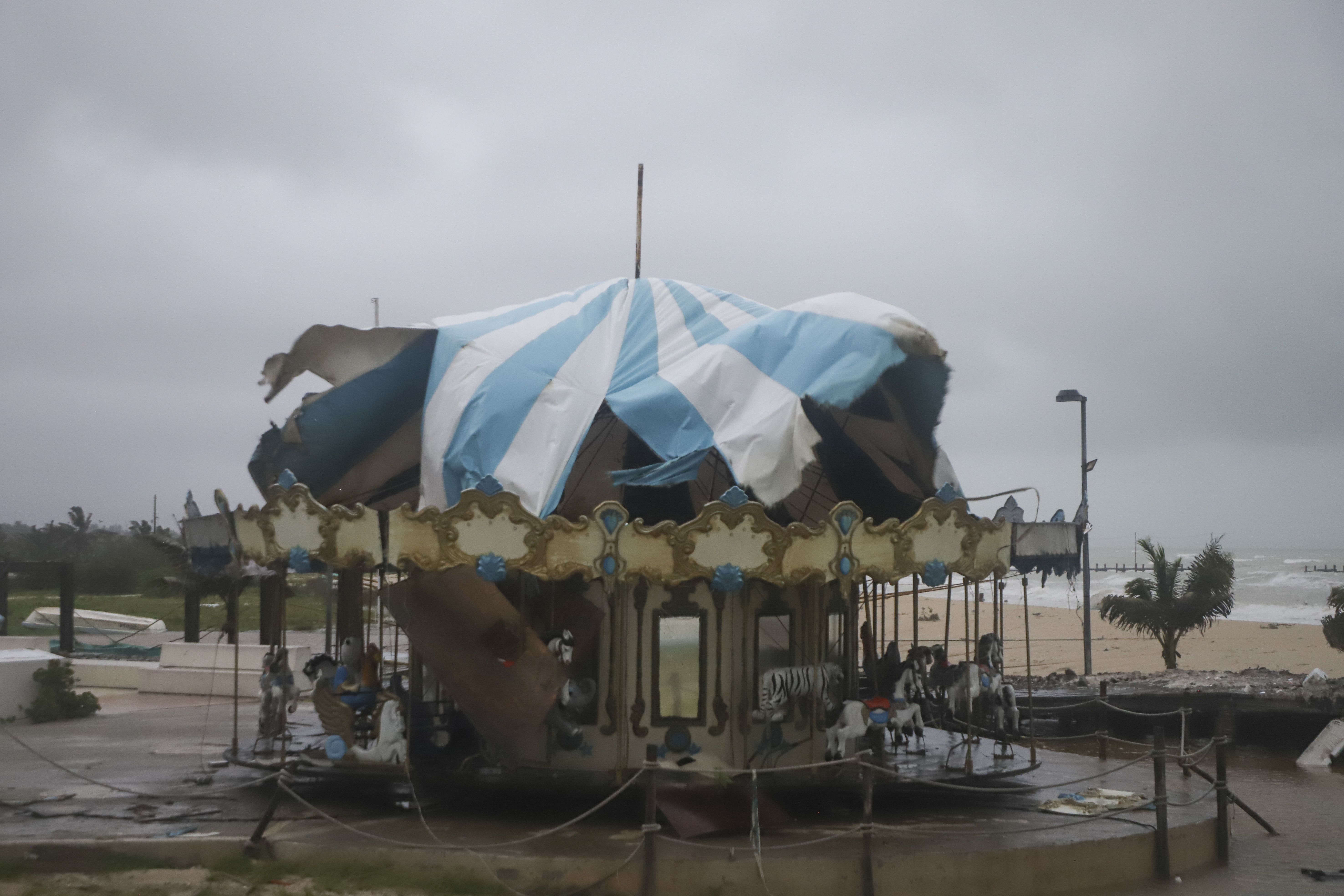 A carousel stands damaged after the eye of Hurricane Milton passed off the coast of Progreso, Yucatan state, Mexico, Tuesday, Oct. 8, 2024. (AP Photo/Martin Zetina)