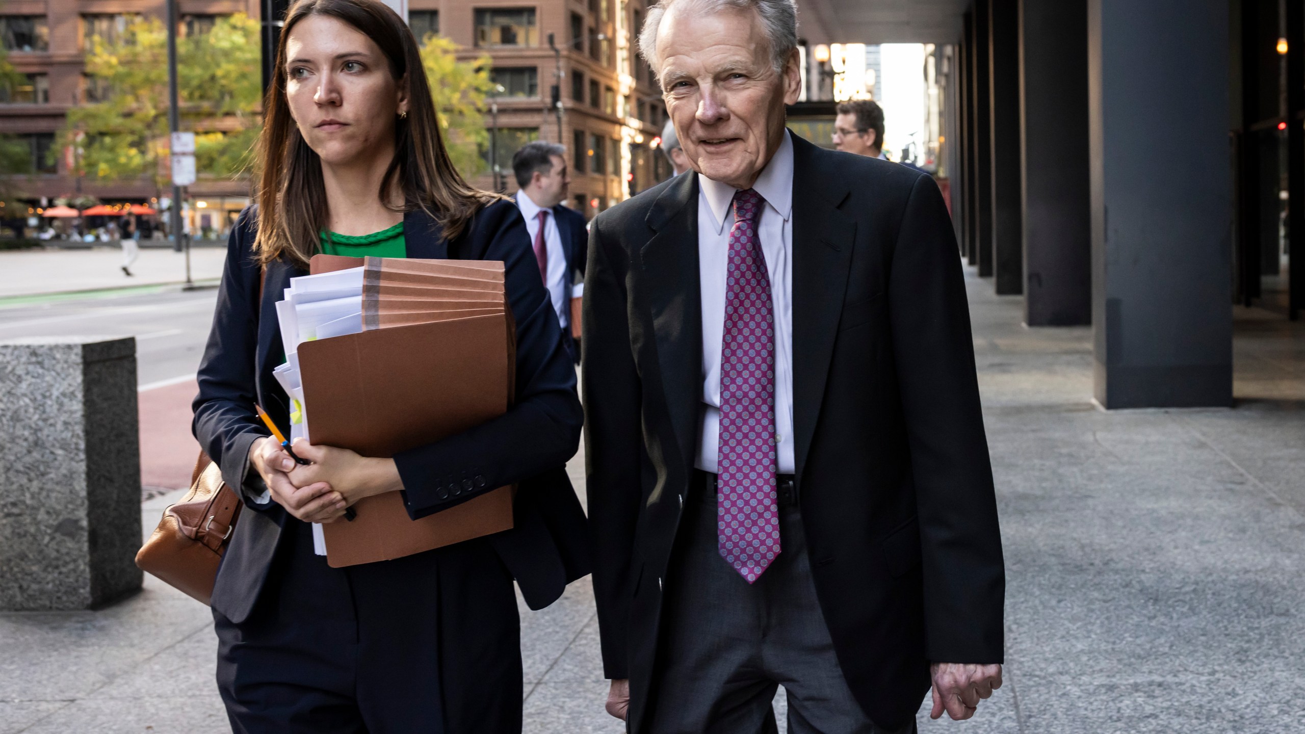 Illinois' former House Speaker Michael Madigan, charged in a multimillion-dollar racketeering and bribery scheme that included the state’s largest utility, ComEd, walks out of the Dirksen Federal Courthouse, Wednesday, Oct. 9, 2024 in Chicago. (Ashlee Rezin/Chicago Sun-Times via AP)